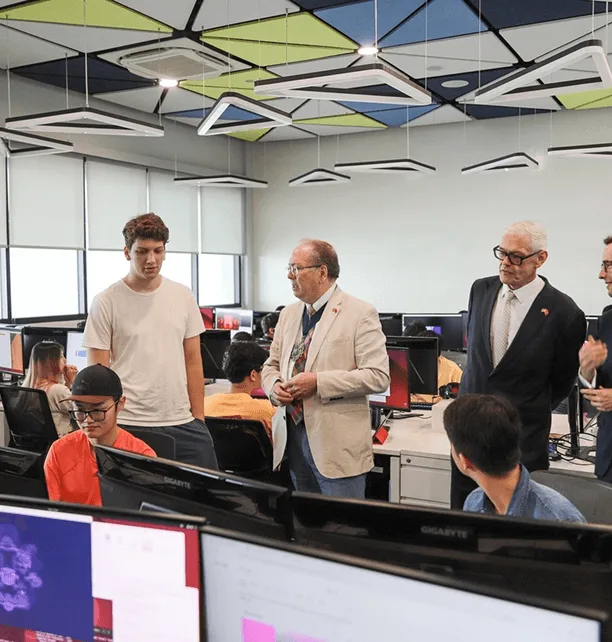 BUV students learning in a modern computer lab with international lecturers in Vietnam