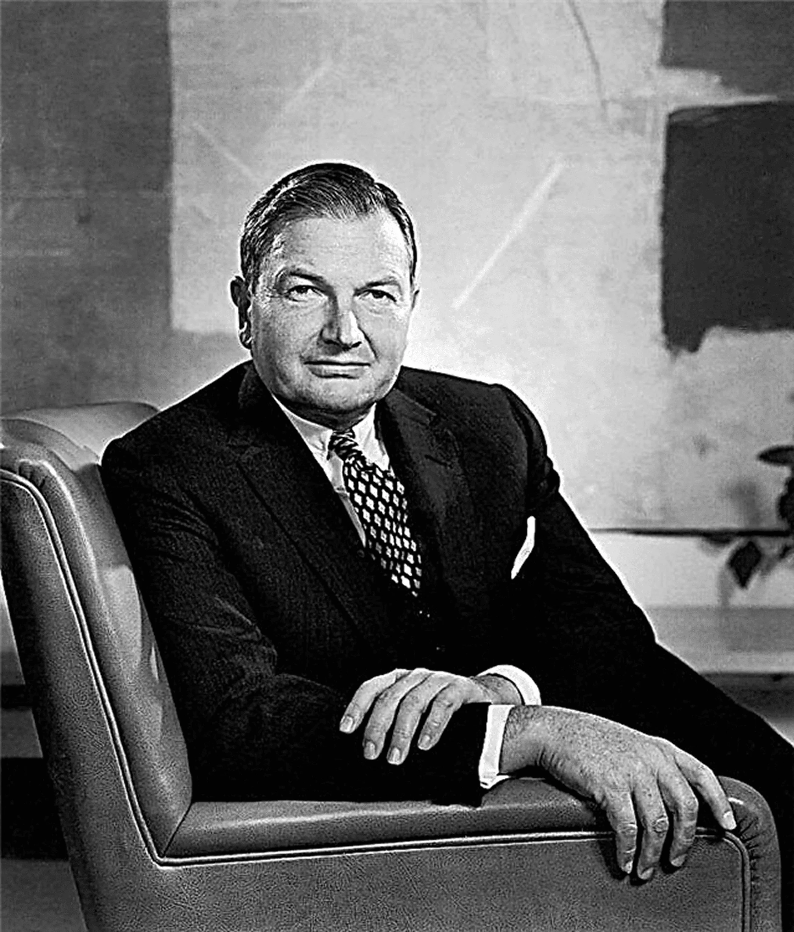 Black-and-white historical portrait of a formally dressed man seated in an armchair.