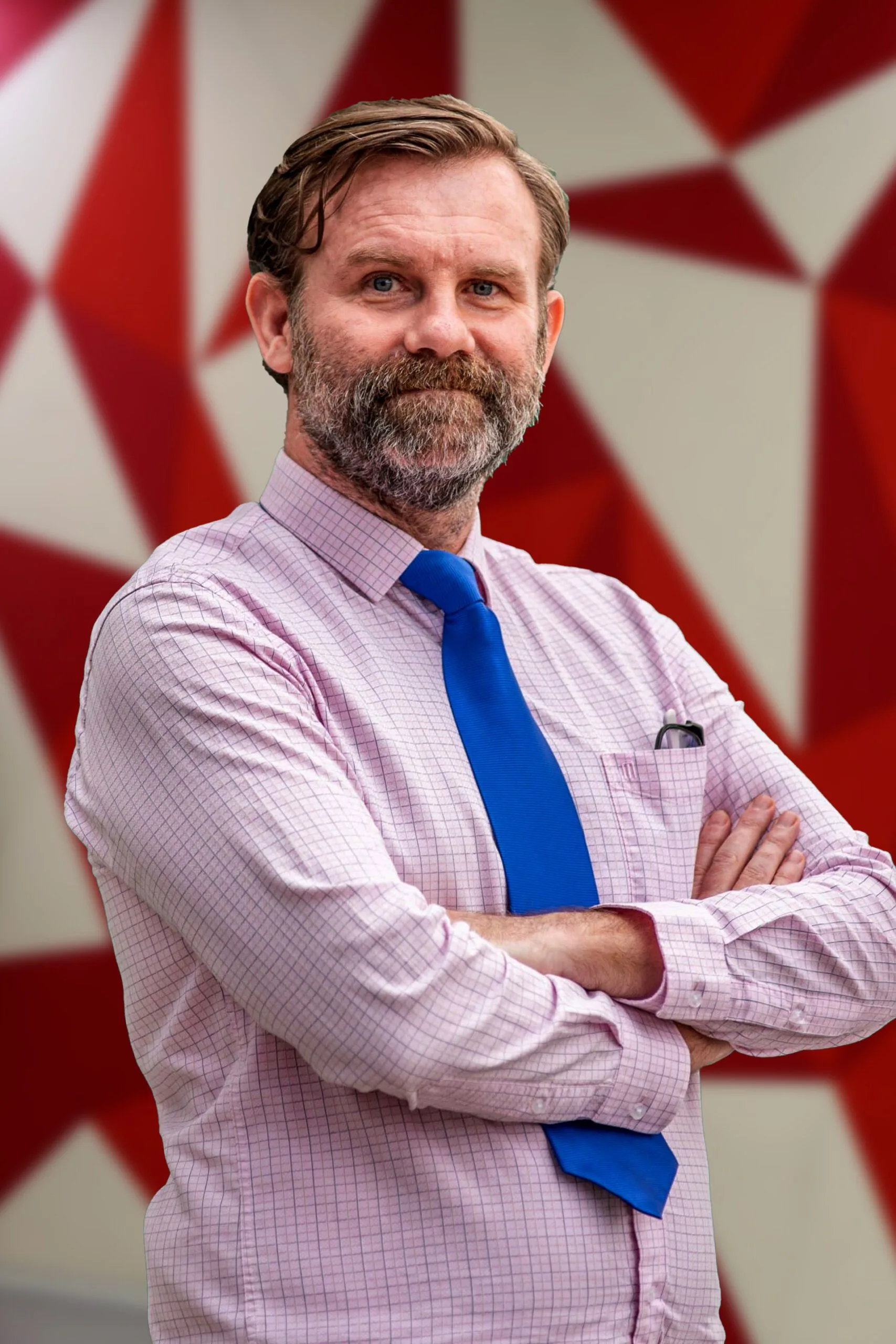 James McMillan at British University Vietnam, wearing a pink shirt and blue tie