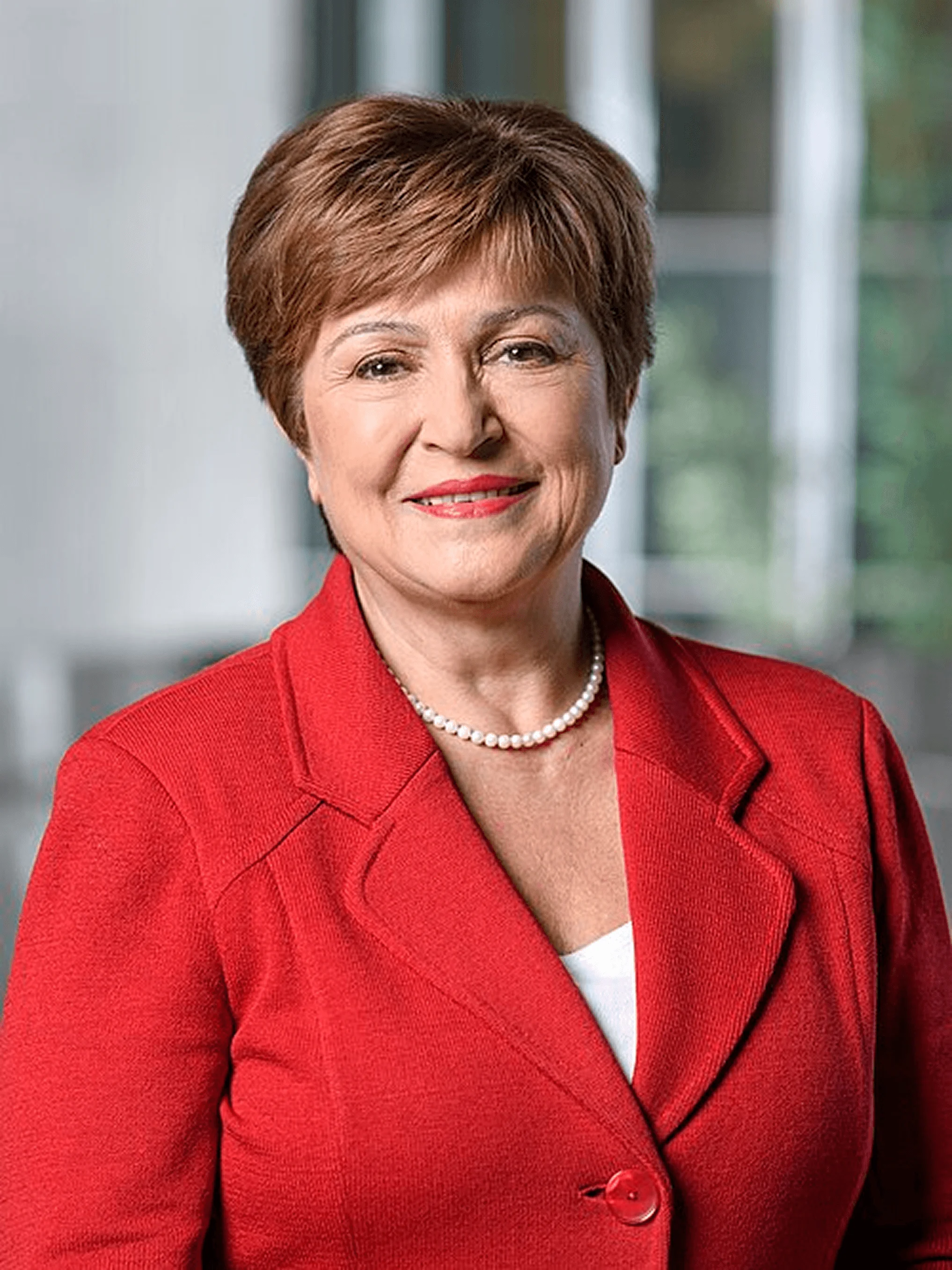 Kristalina Georgieva, IMF Managing Director, wearing a red blazer and pearl necklace.