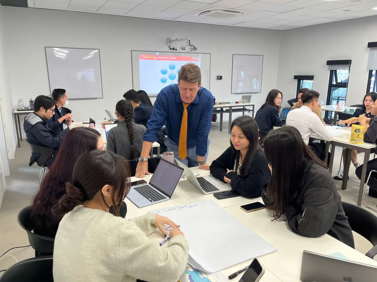 British University Vietnam students collaborate with a lecturer in an international classroom workshop