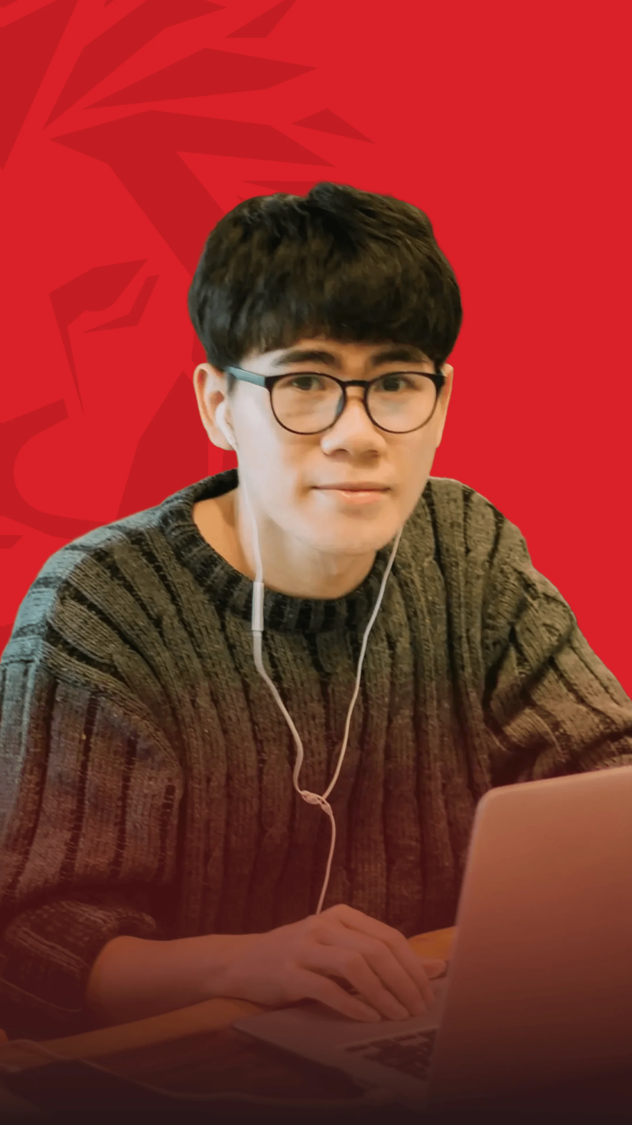 Le Minh Thanh, BUV student studying online with a laptop and earphones