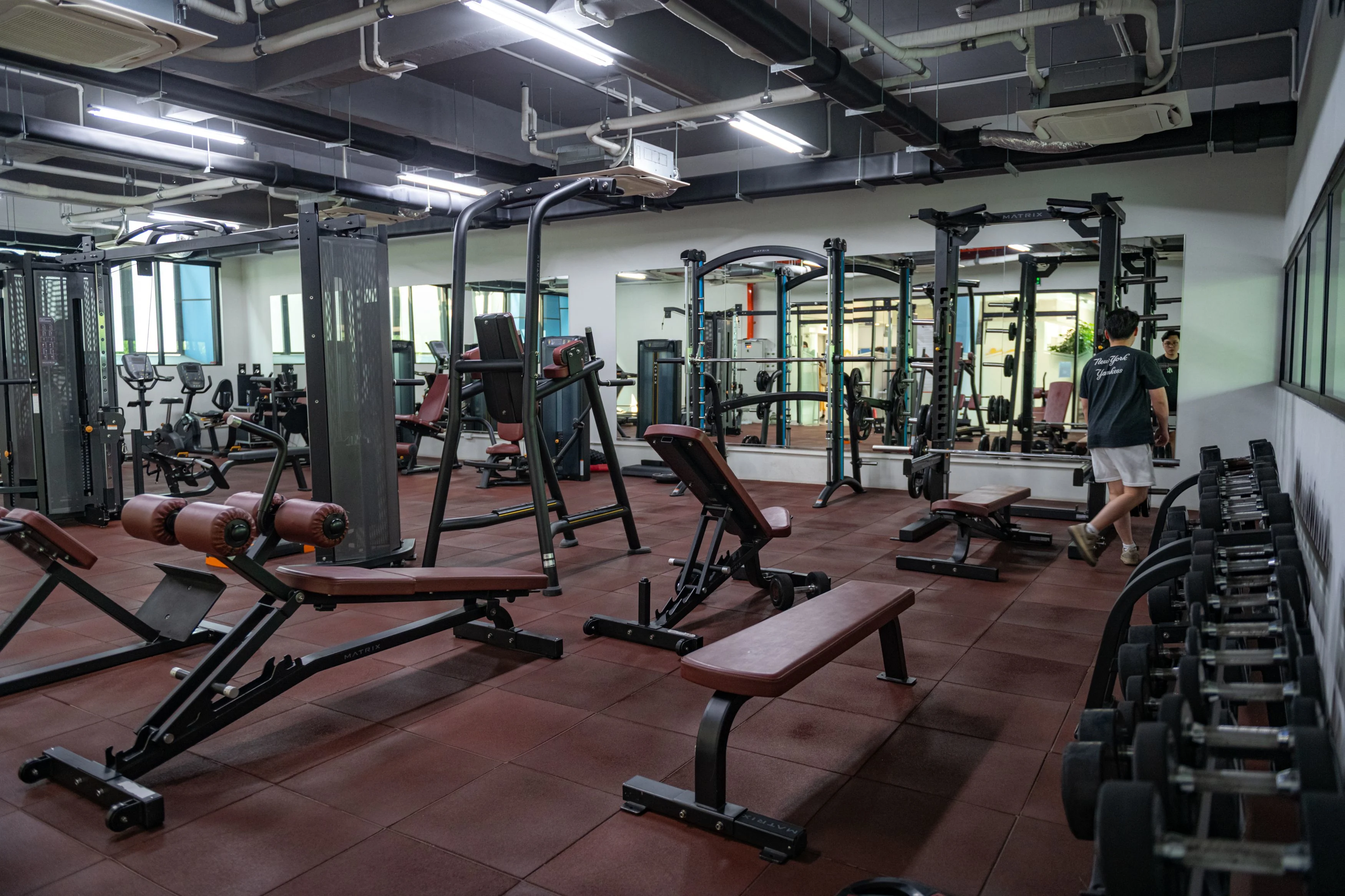 BUV fitness center with modern Matrix gym equipment, weight benches, racks and free weights.