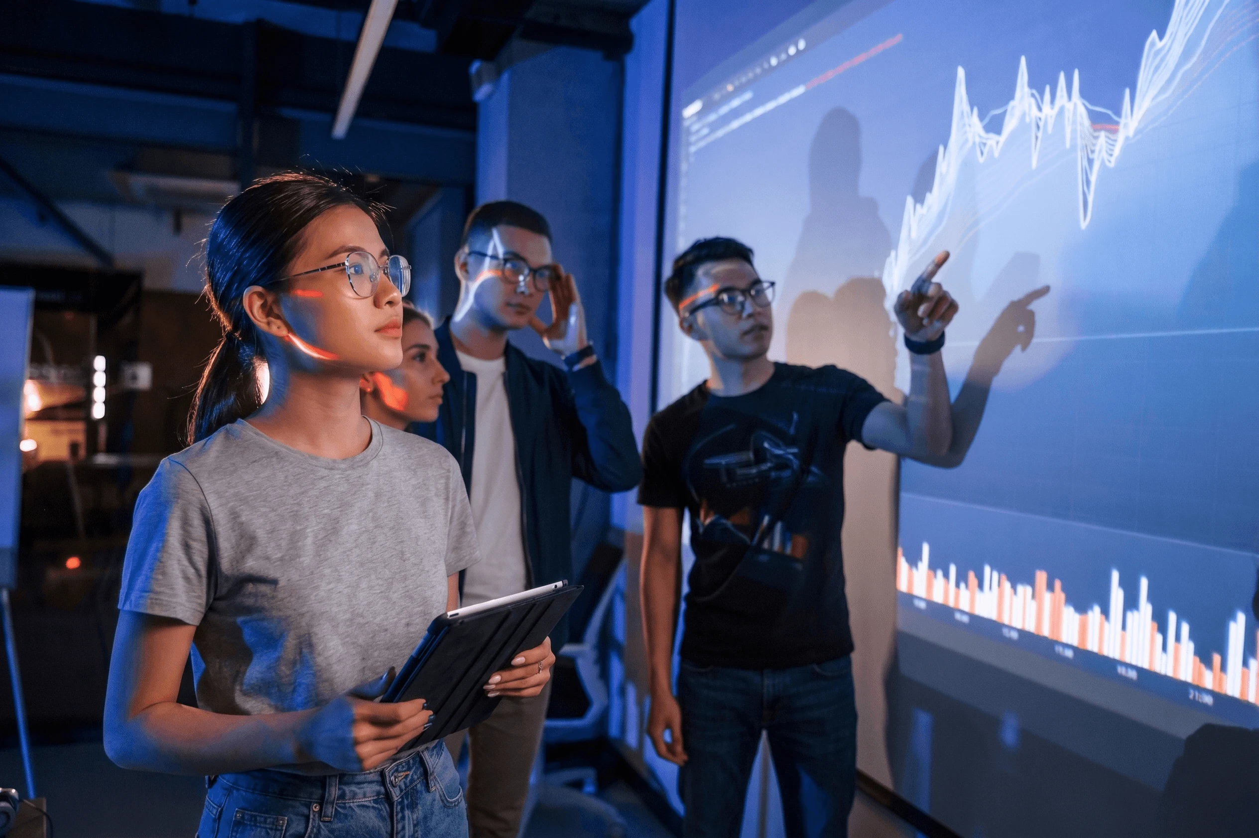 Students analyzing data visualizations in a Data Science and AI class at British University Vietnam