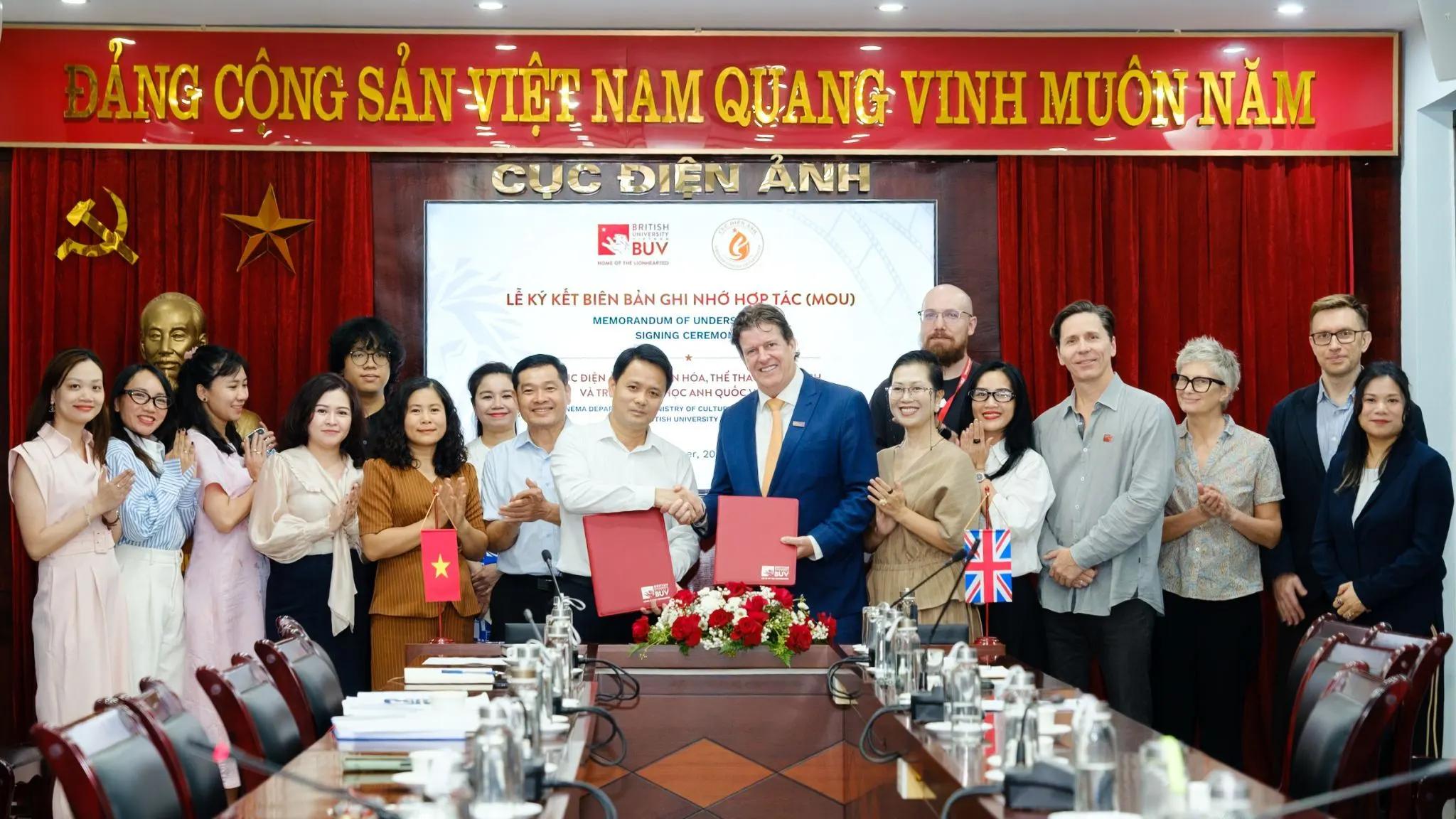 BUV and Vietnam’s Department of Cinema representatives celebrate signing a cooperation memorandum at a ceremony in Hanoi.