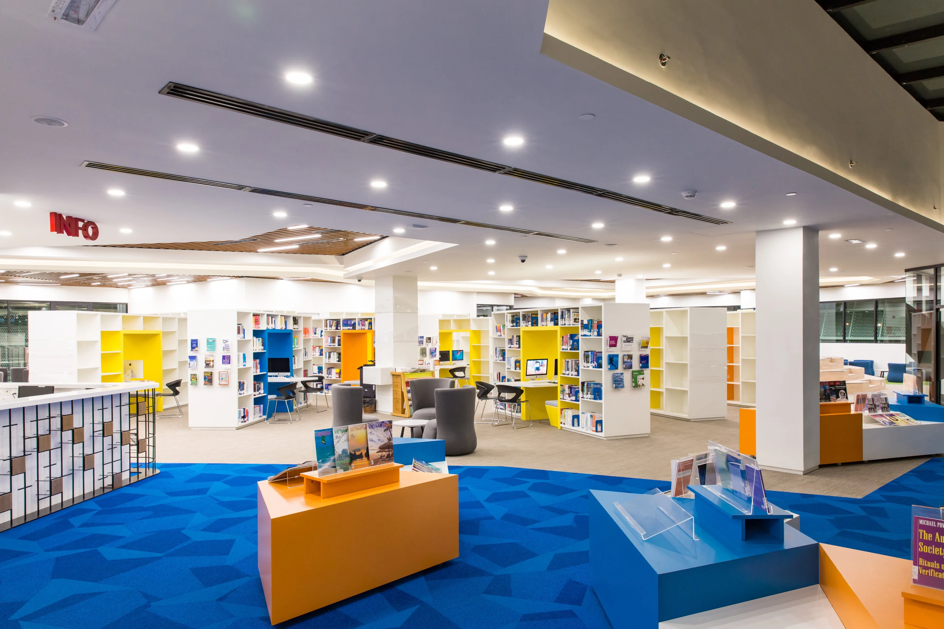 British University Vietnam library with colorful bookshelves, study spaces, and modern student learning facilities