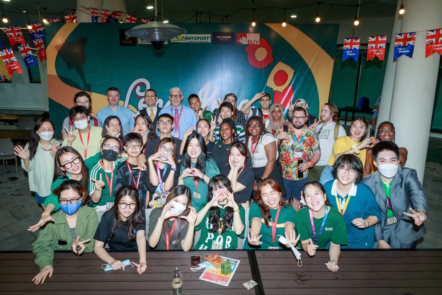 A group of students and staff posing for a photo at a BUV event.