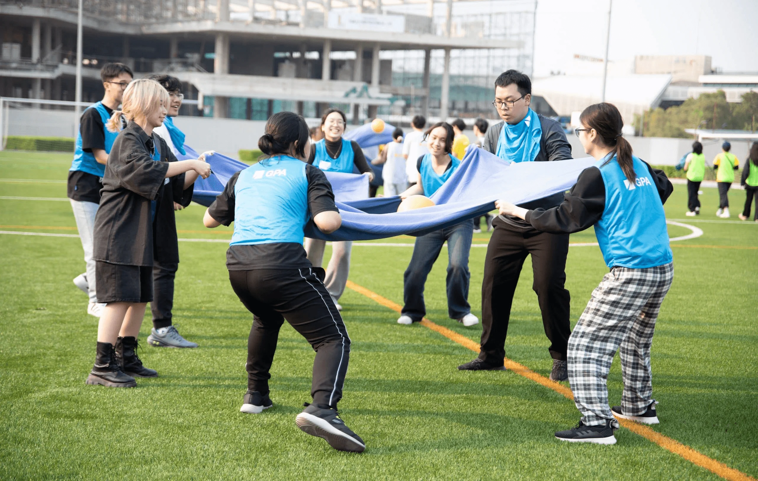 BUV students take part in a team-building activity on the campus football field