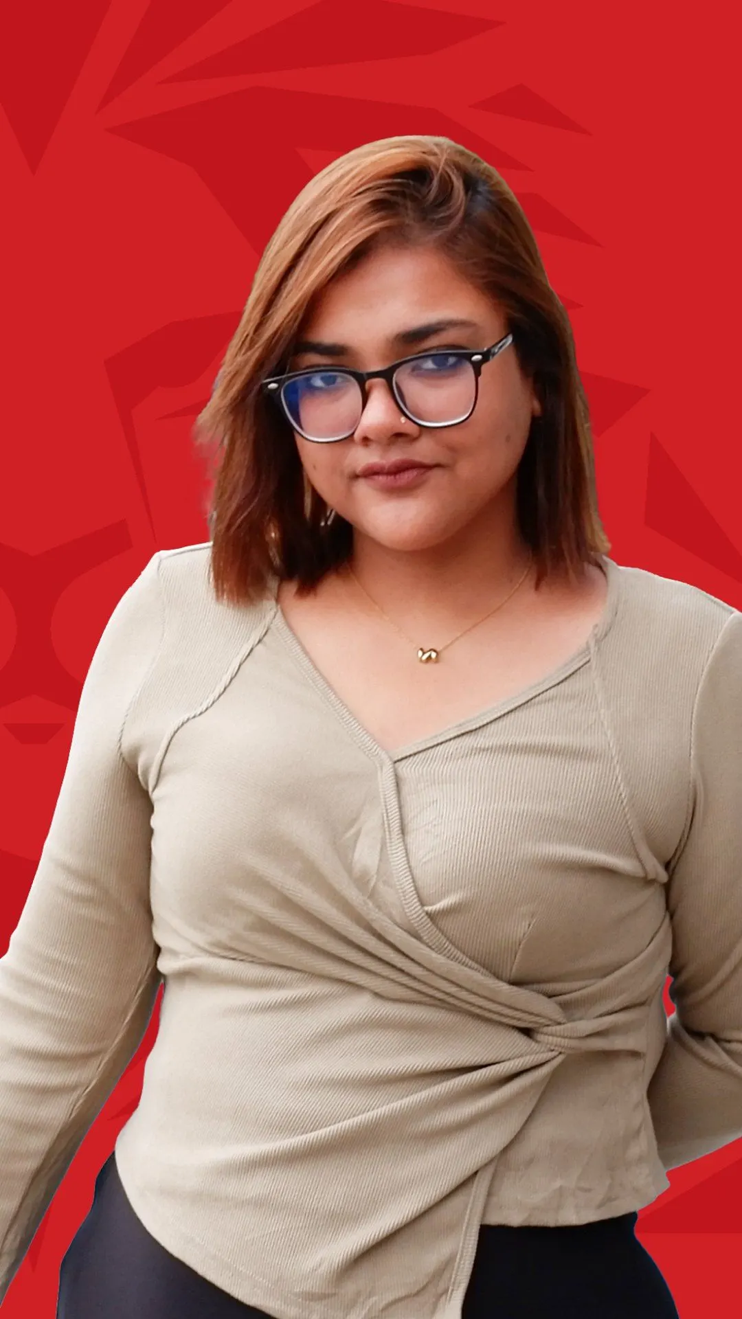 BUV alumna Sandra Christina Talukder in a portrait against a red background.