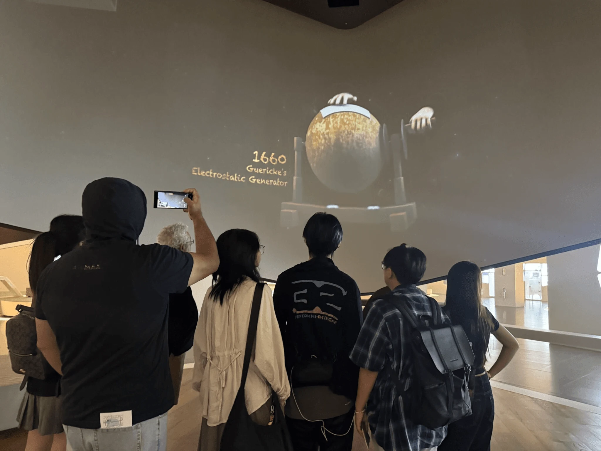 BUV international study course students viewing Guericke’s 1660 electrostatic generator at a science museum