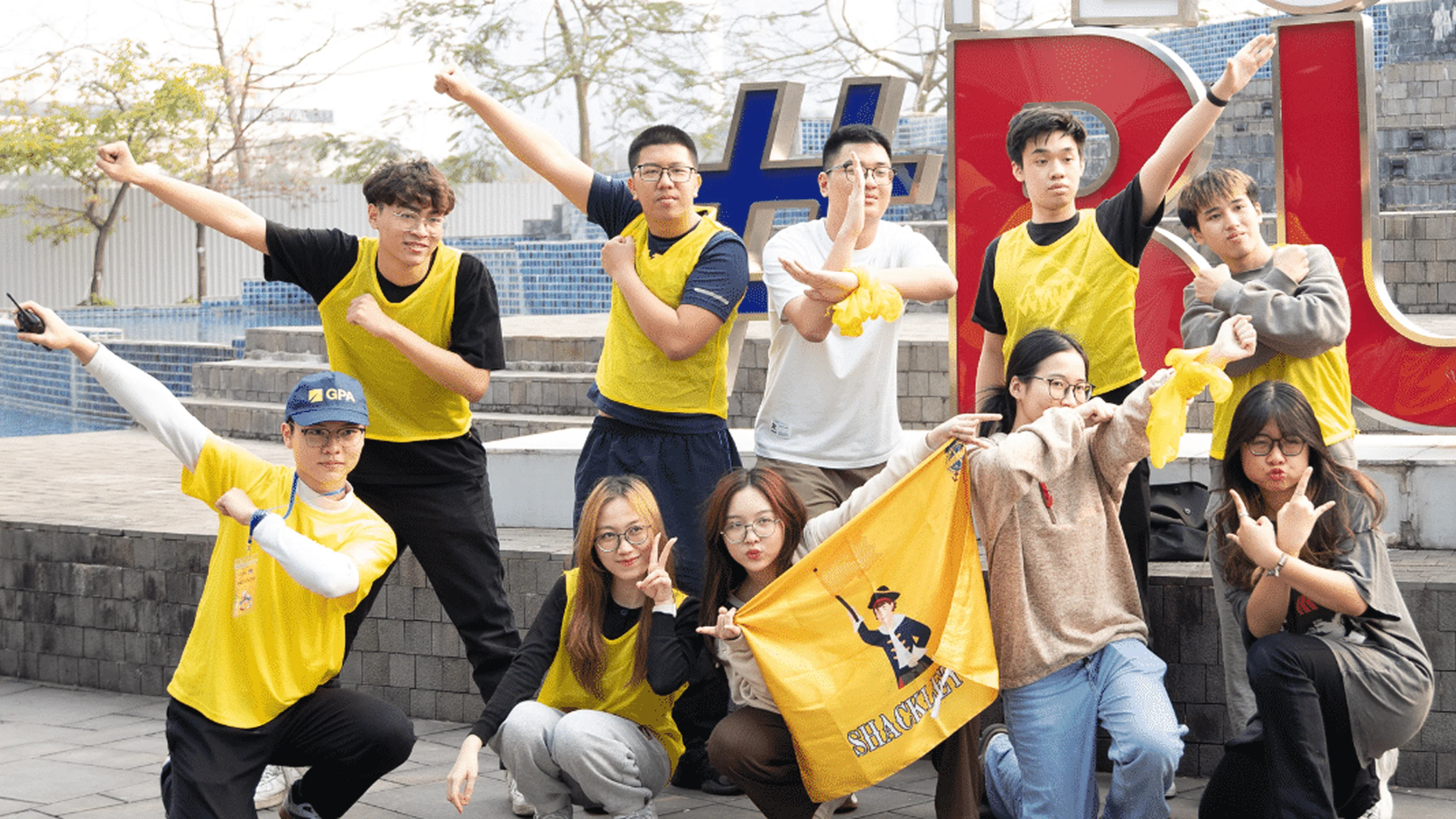 BUV students celebrating together during a vibrant university campus activity in Vietnam
