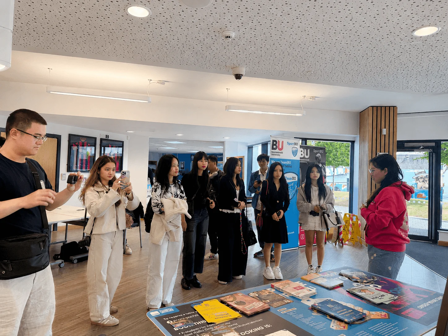 Students explore an educational display during a guided global learning tour at BUV.