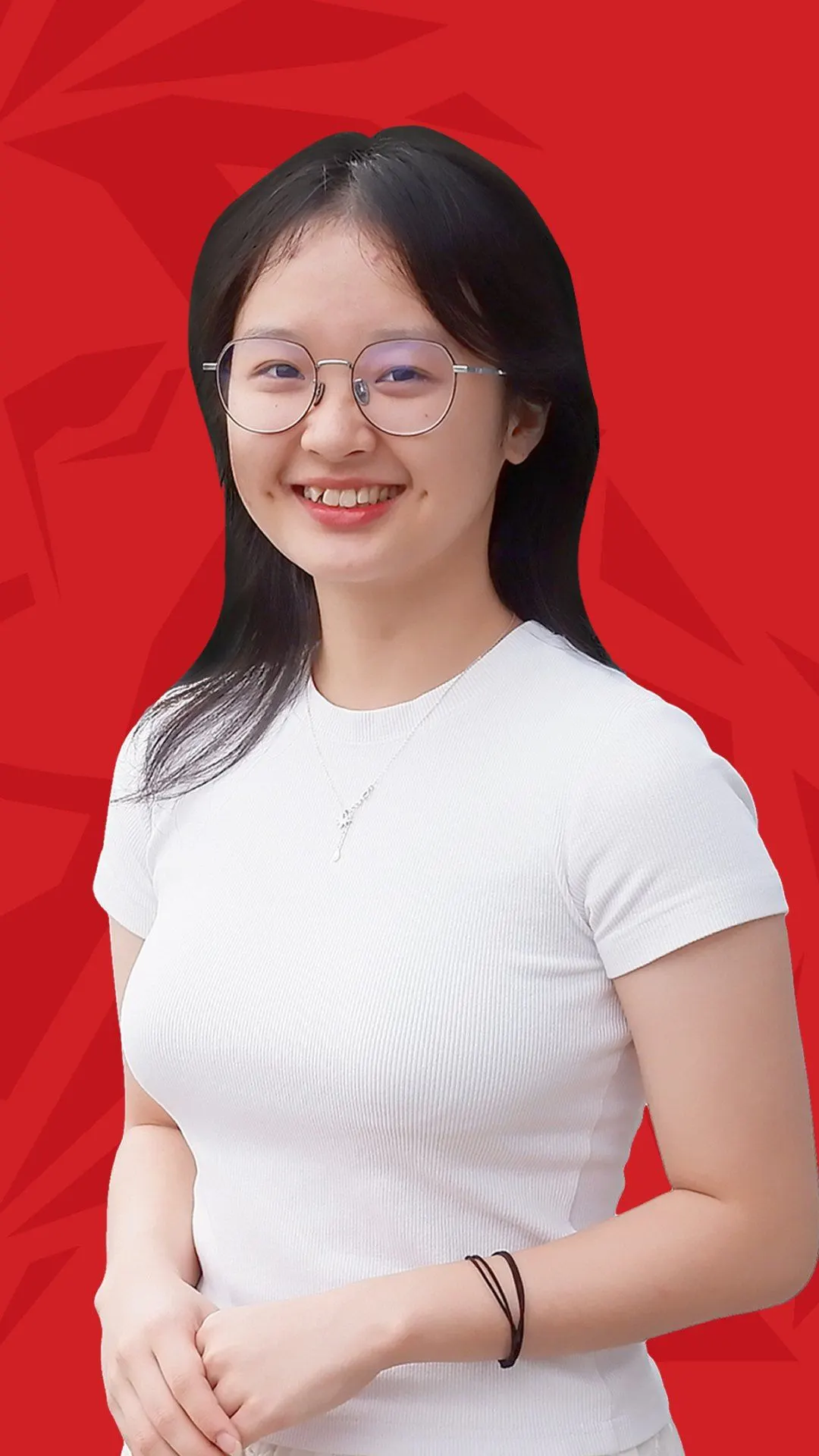 BUV alumna Ngoc Anh smiling in glasses and a white top against a red background.