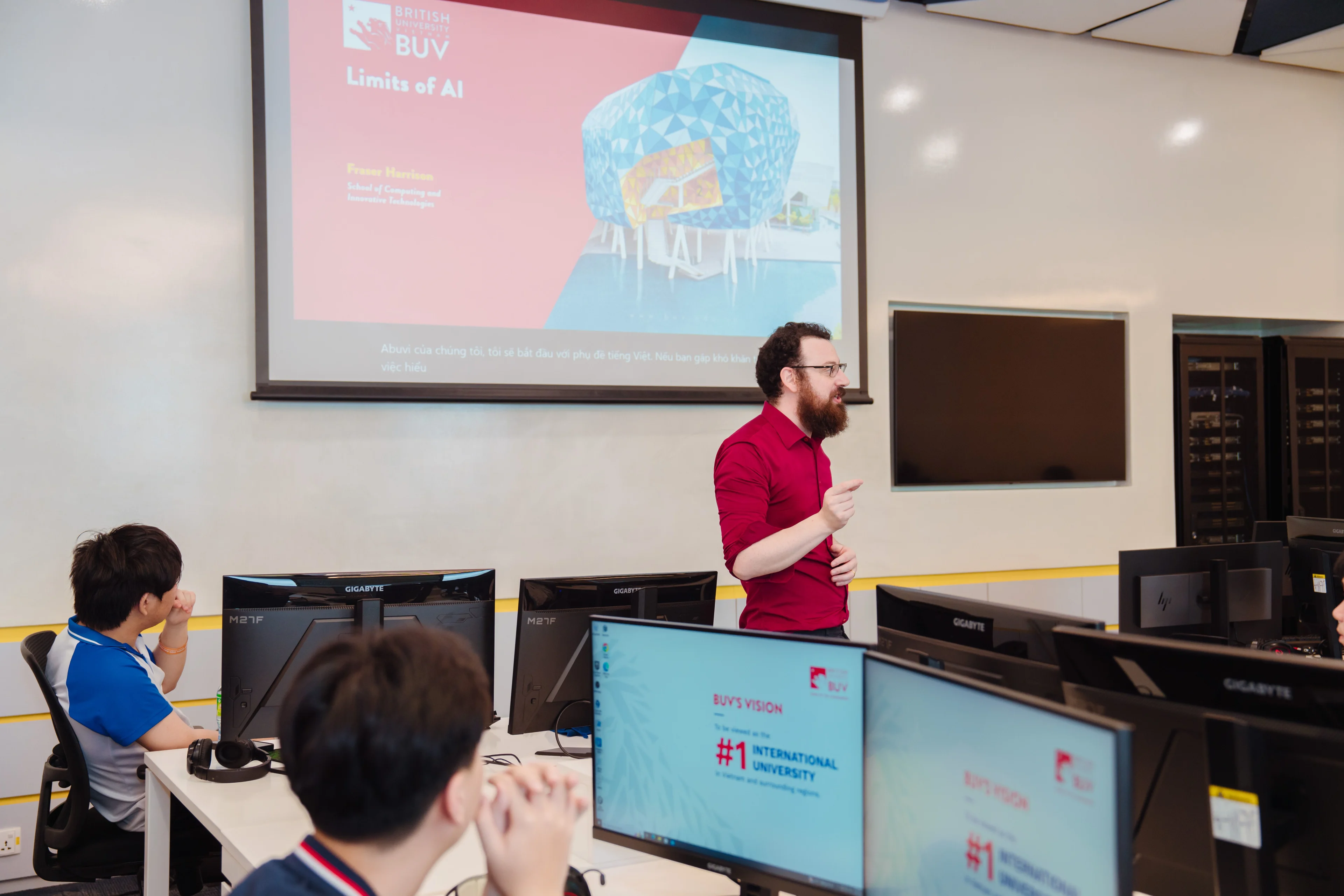BUV lecturer presents “Limits of AI” to students in a computer lab at British University Vietnam.