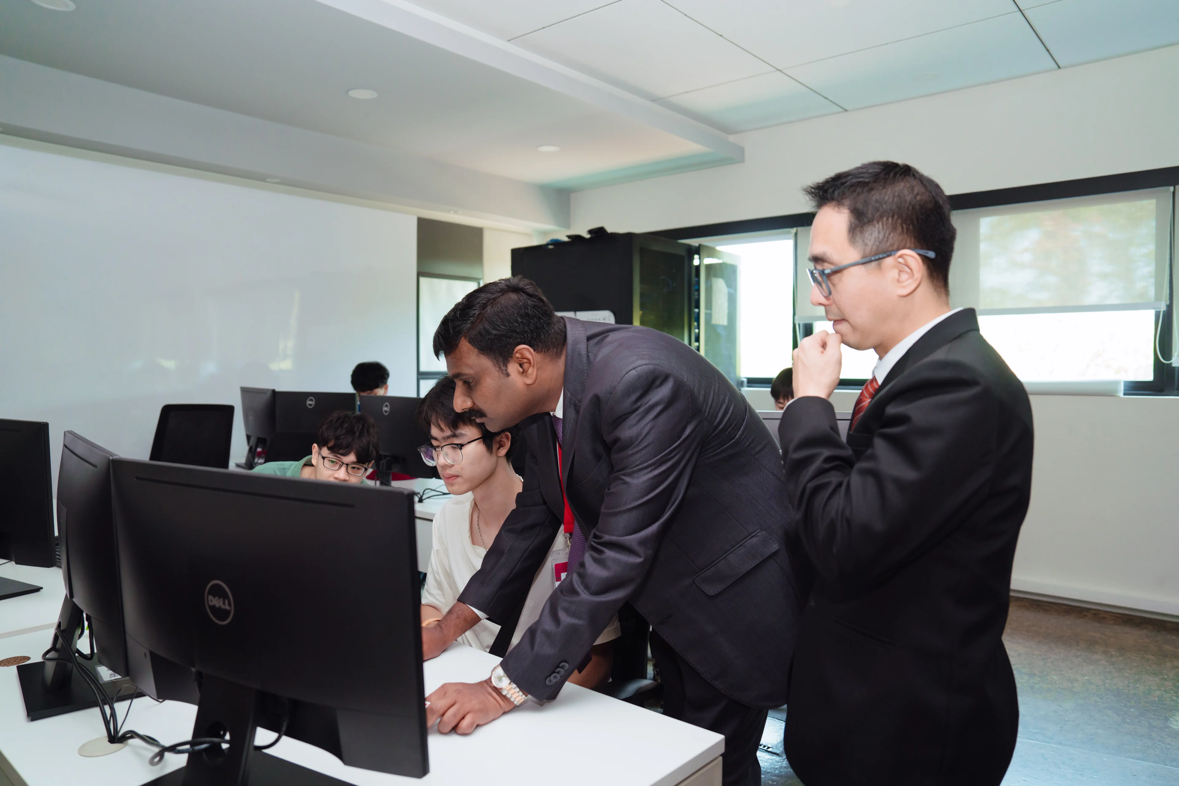 BUV computer lab with lecturers guiding students during practical learning