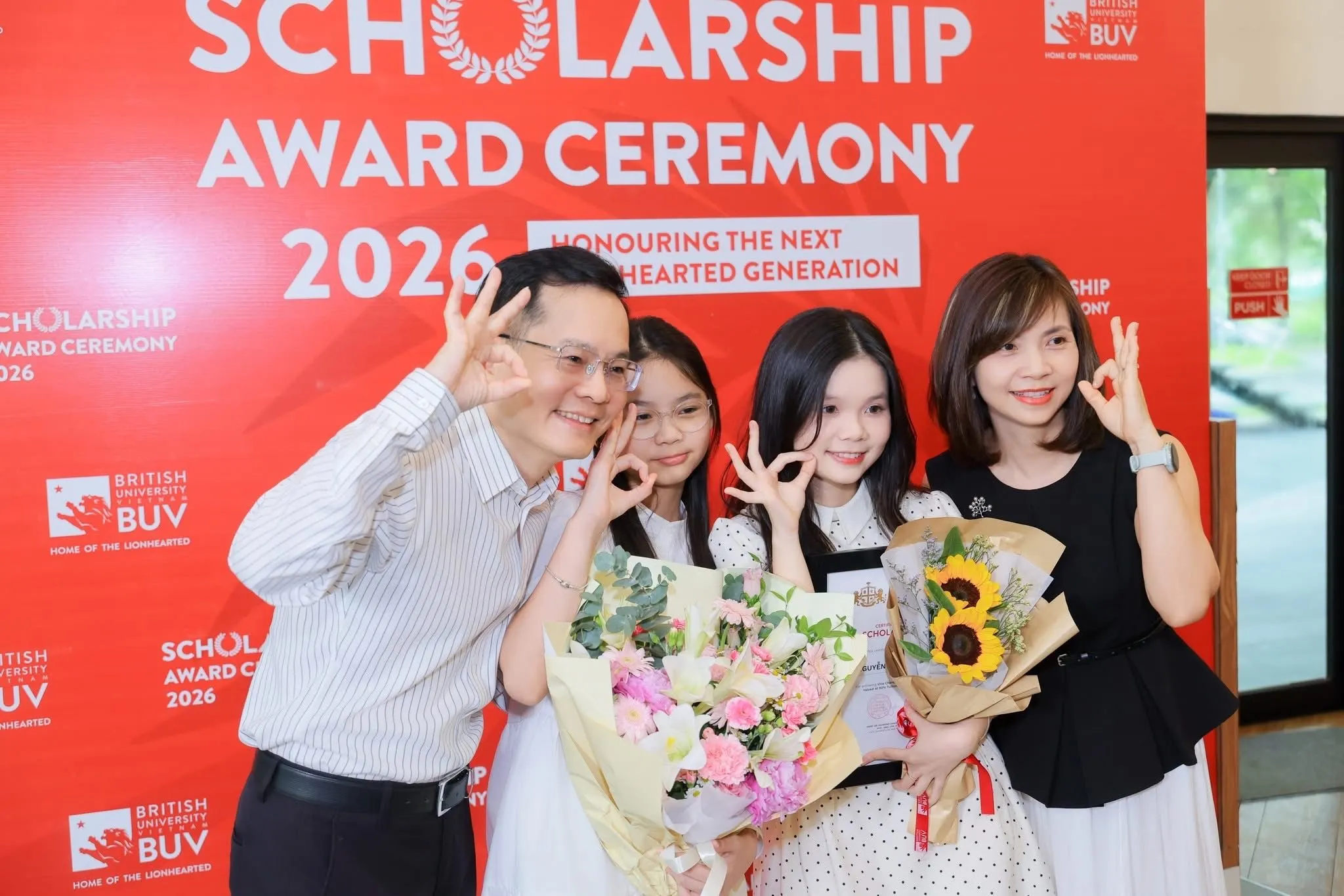 BUV Scholarship Award Ceremony 2026 celebrates Nguyen Le Vy Anh with family and flowers.