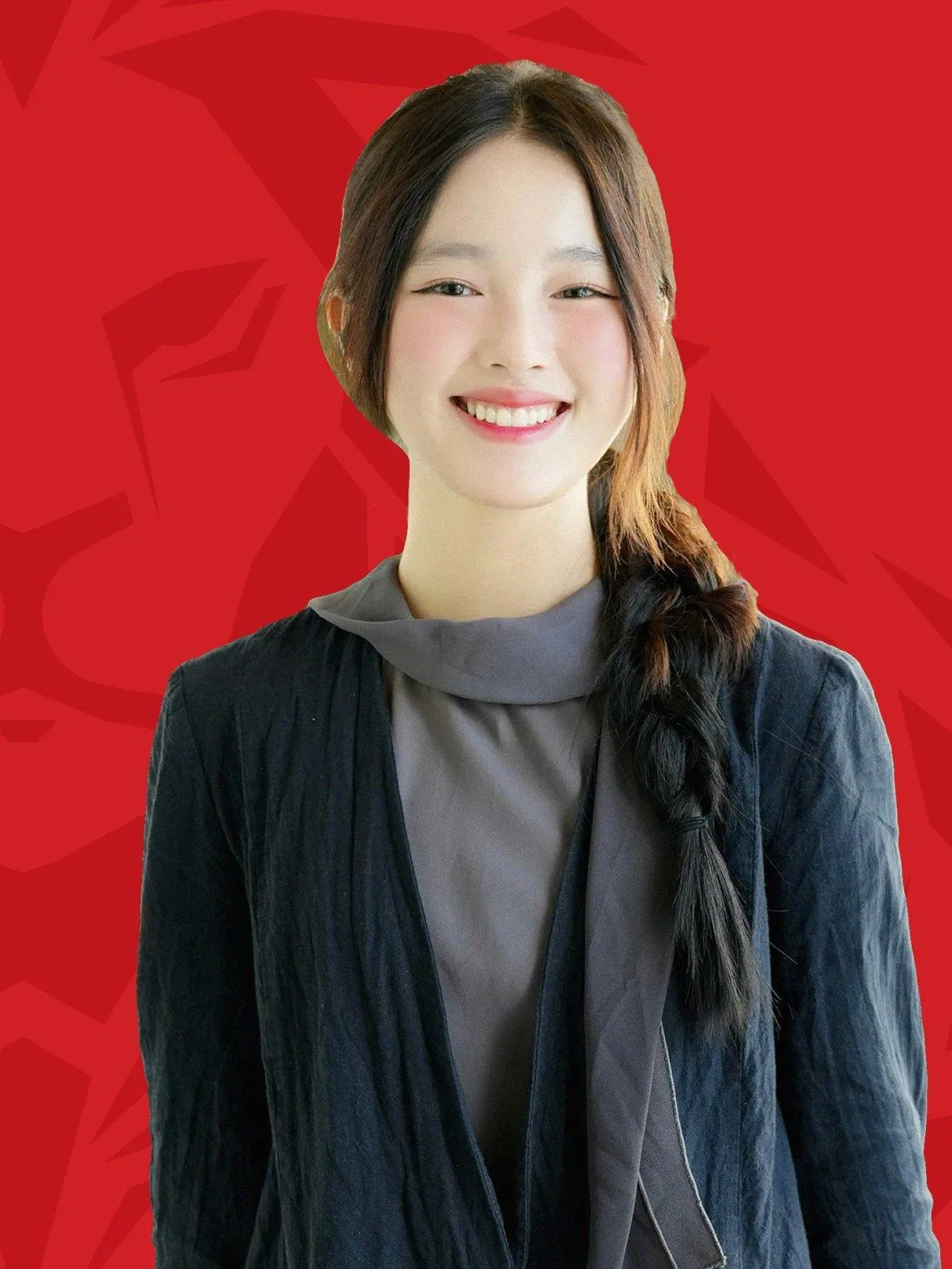 Phuong Anh smiling in a portrait against a red background for BUV’s Lionhearted student feature.