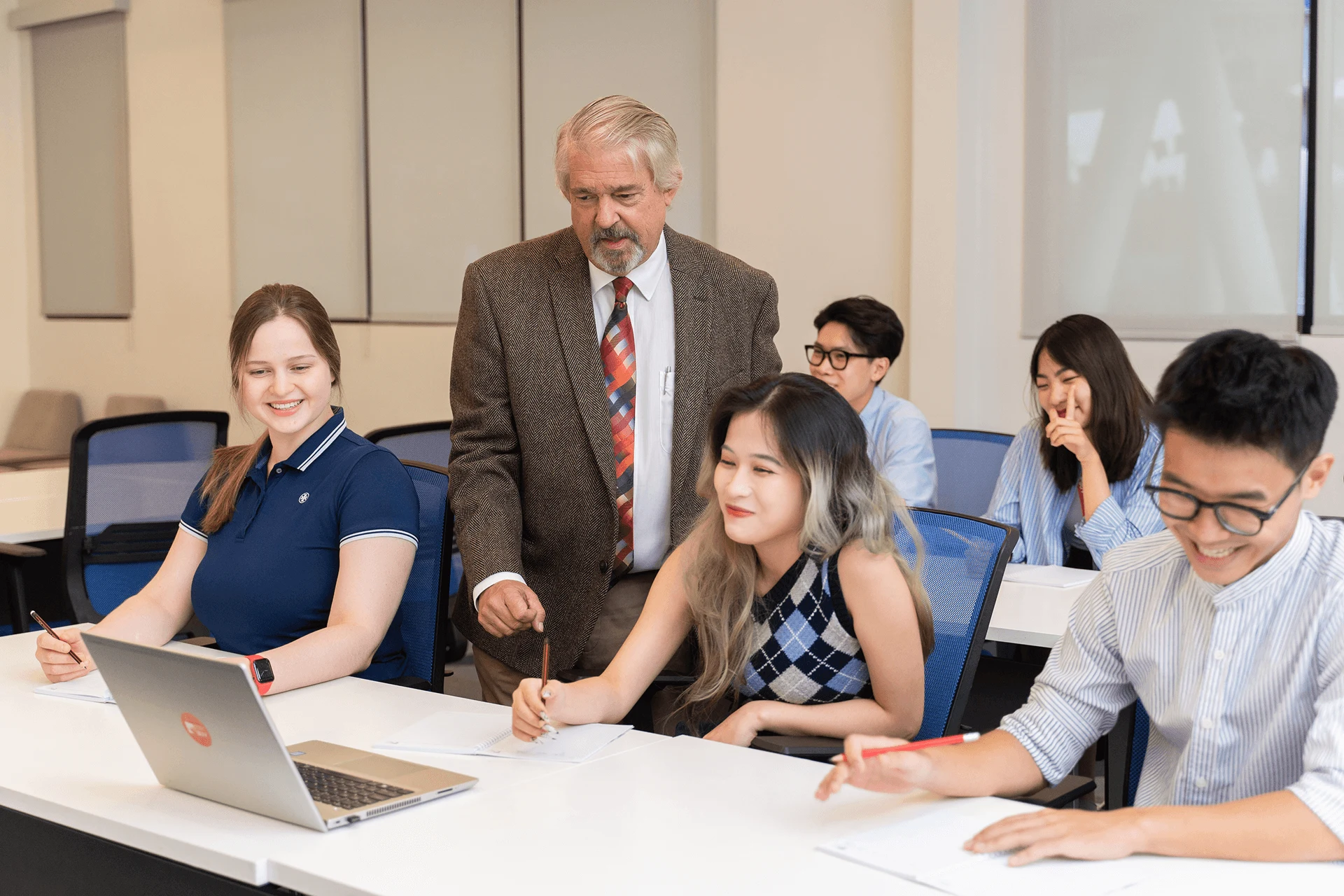 BUV Business and Management class with lecturer and international students collaborating in a modern classroom