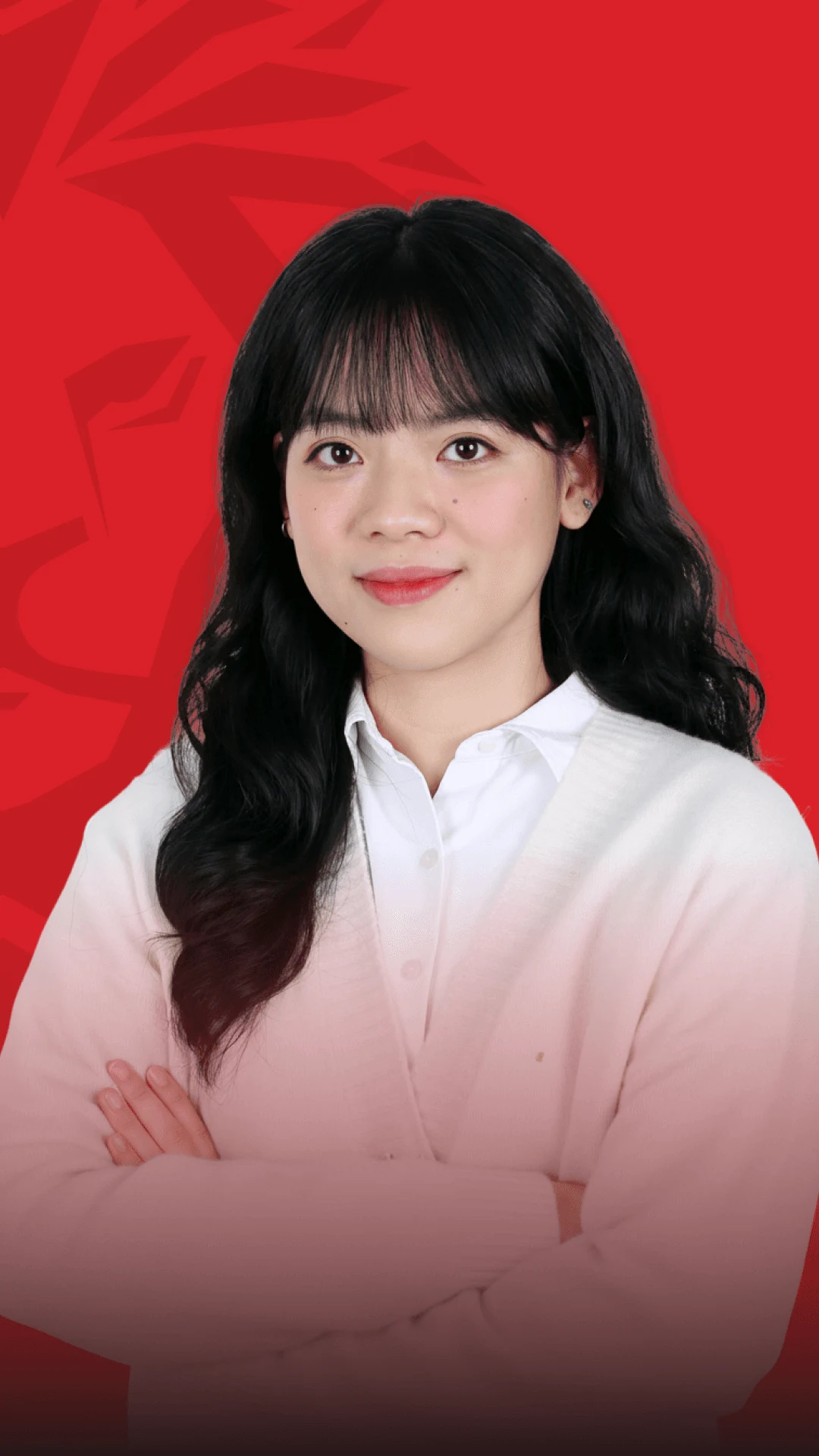 British University Vietnam alumna in a white shirt against a red background
