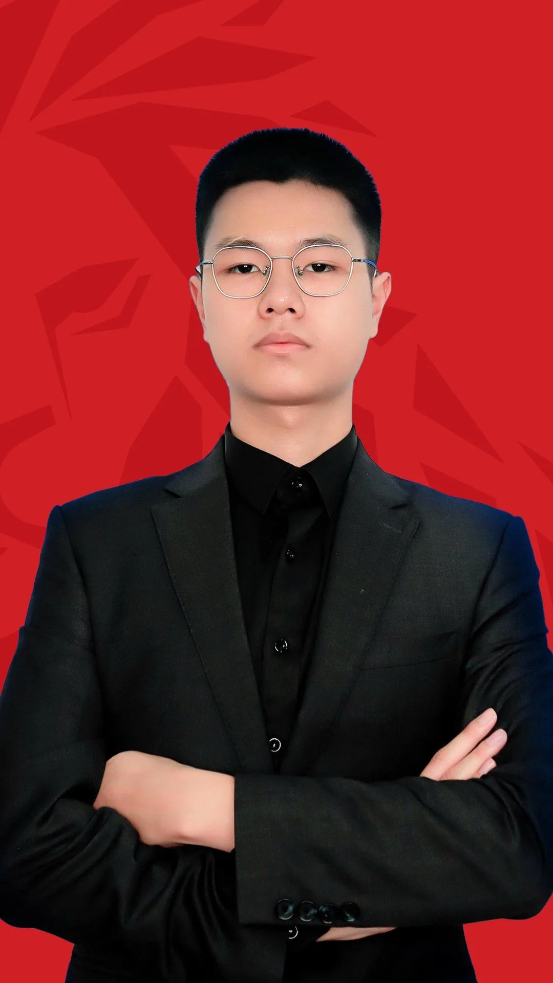 Gia Khanh, BUV alumnus, in a black suit against a red background for the Lionhearted alumni campaign.