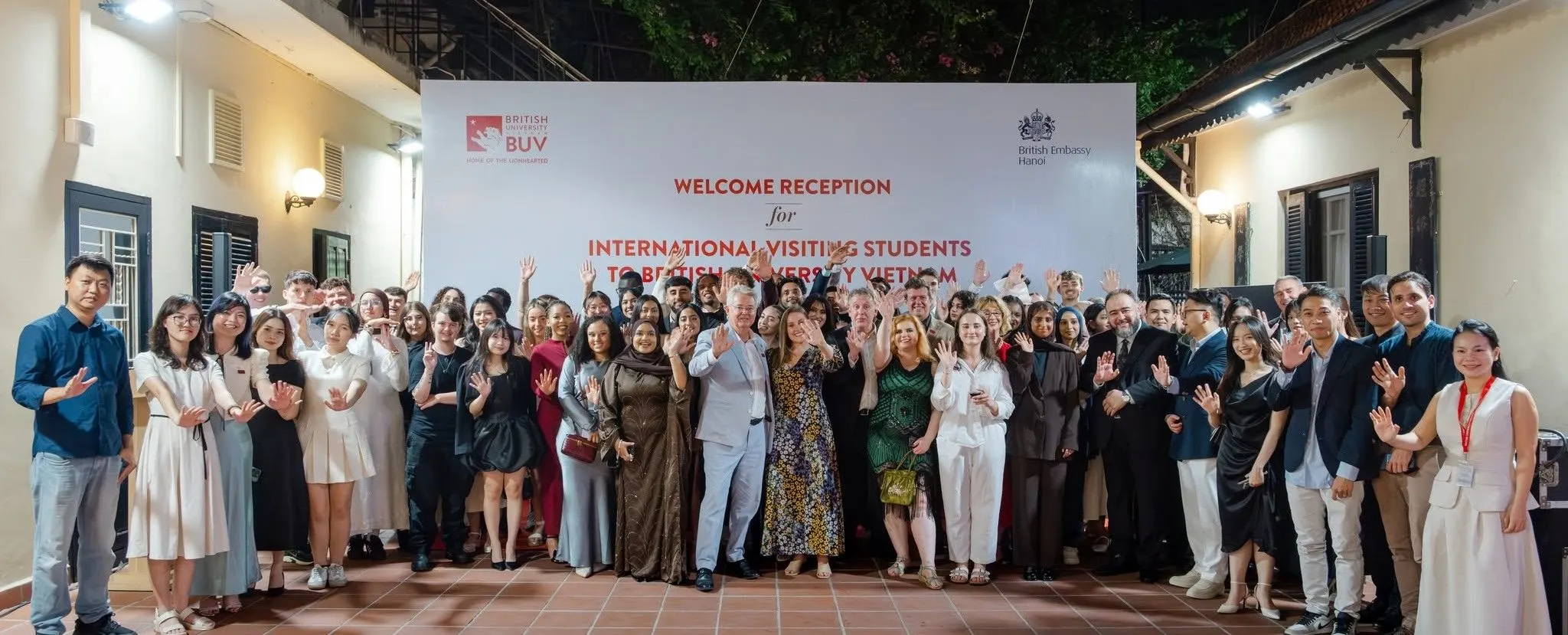 BUV welcomes international visiting students at a reception in Hanoi, with staff and students gathered beneath a welcome banner.