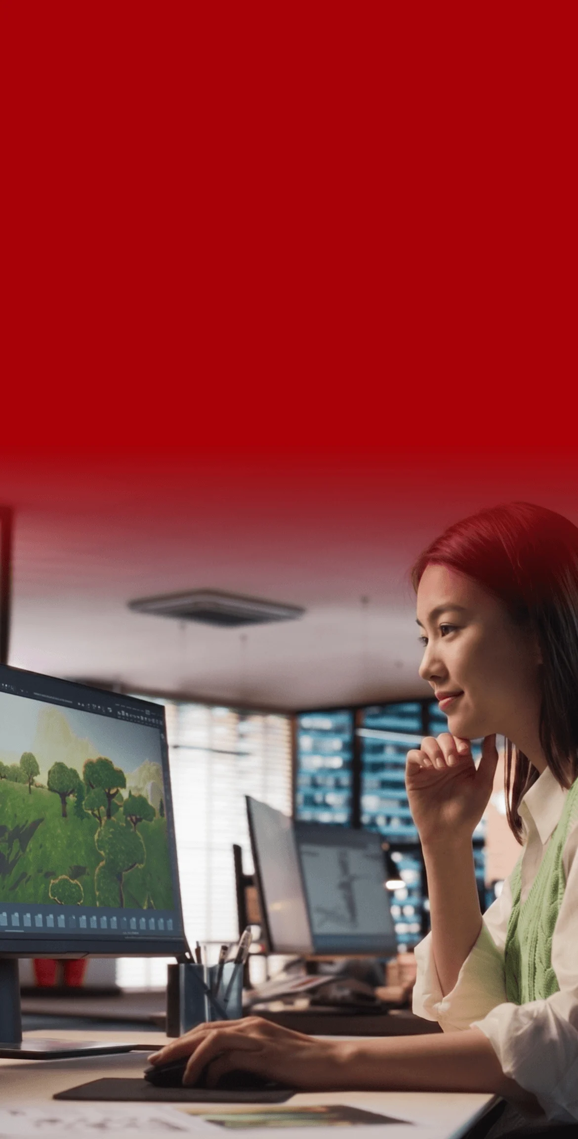 BUV student creating a 3D game environment on a computer in a digital design studio
