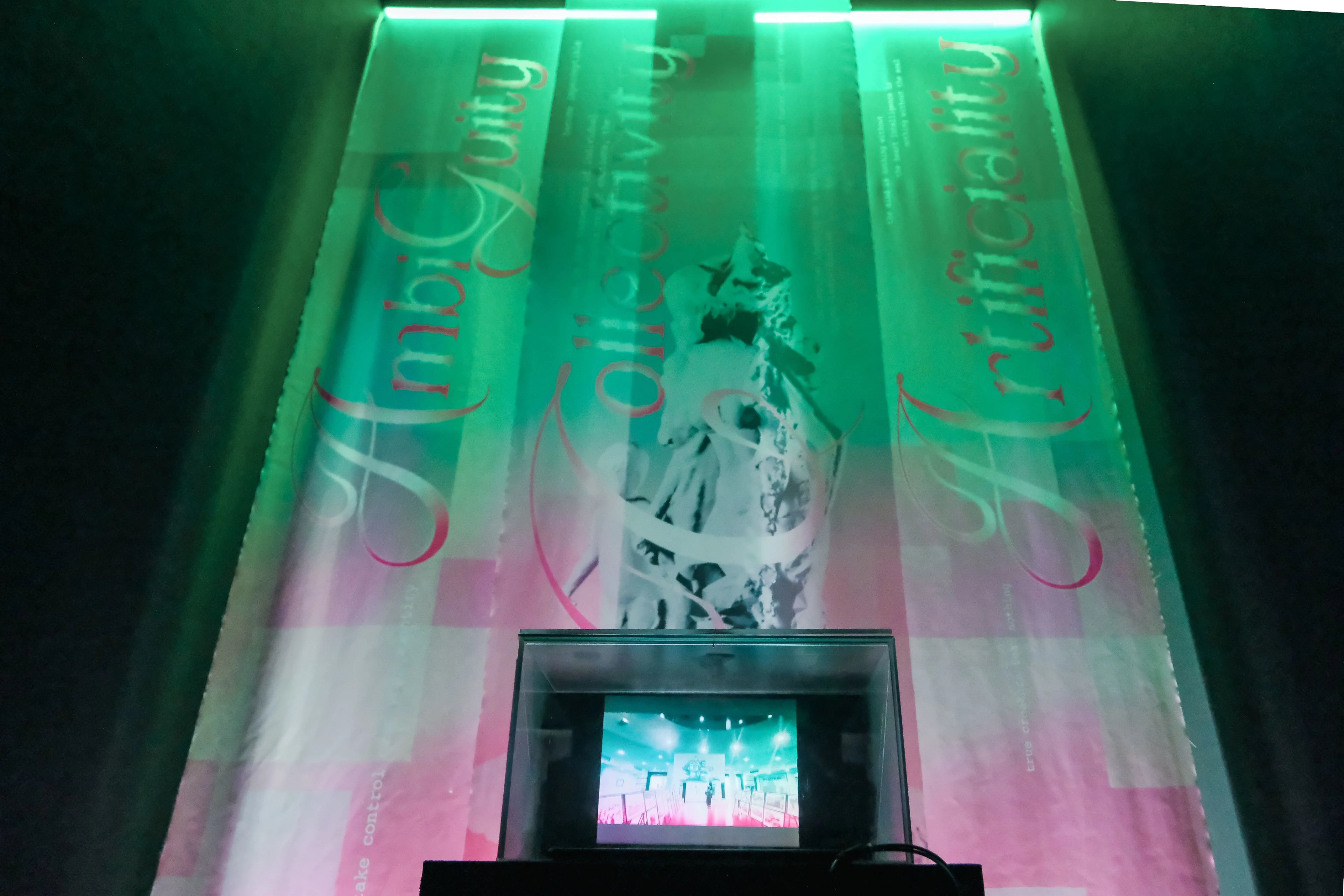 Green-lit “Unification” multimedia fashion installation with projected artwork and digital screen at BUV