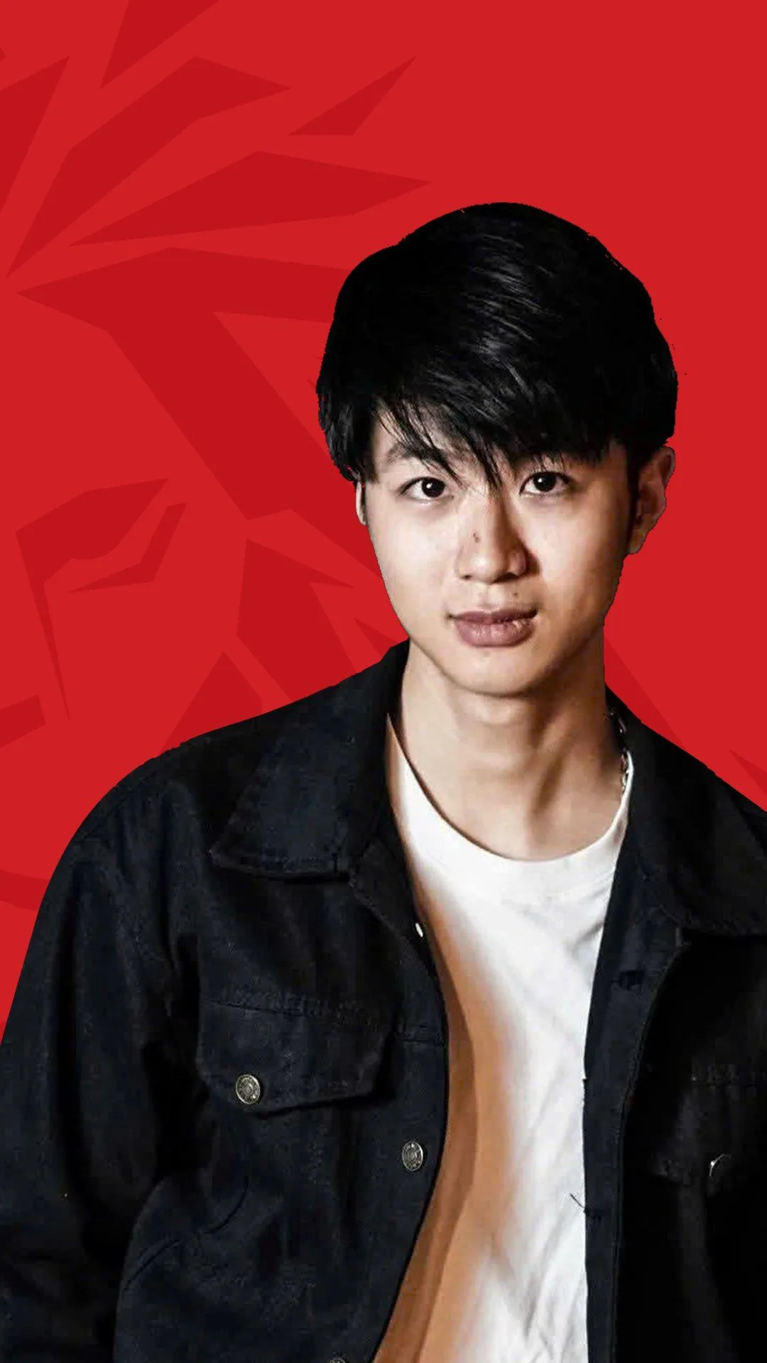 BUV alumnus Trần Minh Đức in a black jacket against a red background, featured in the Lionhearted alumni campaign.