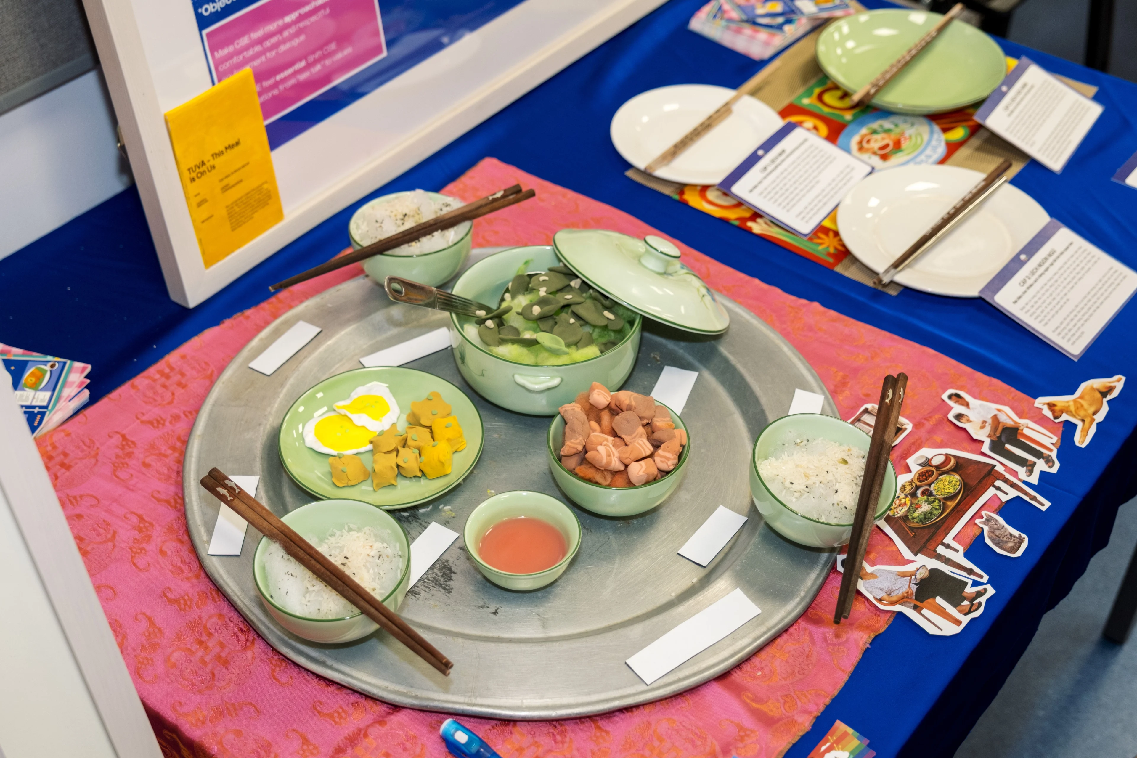 Traditional Vietnamese meal display with rice bowls, chopsticks and shared dishes at a BUV cultural event