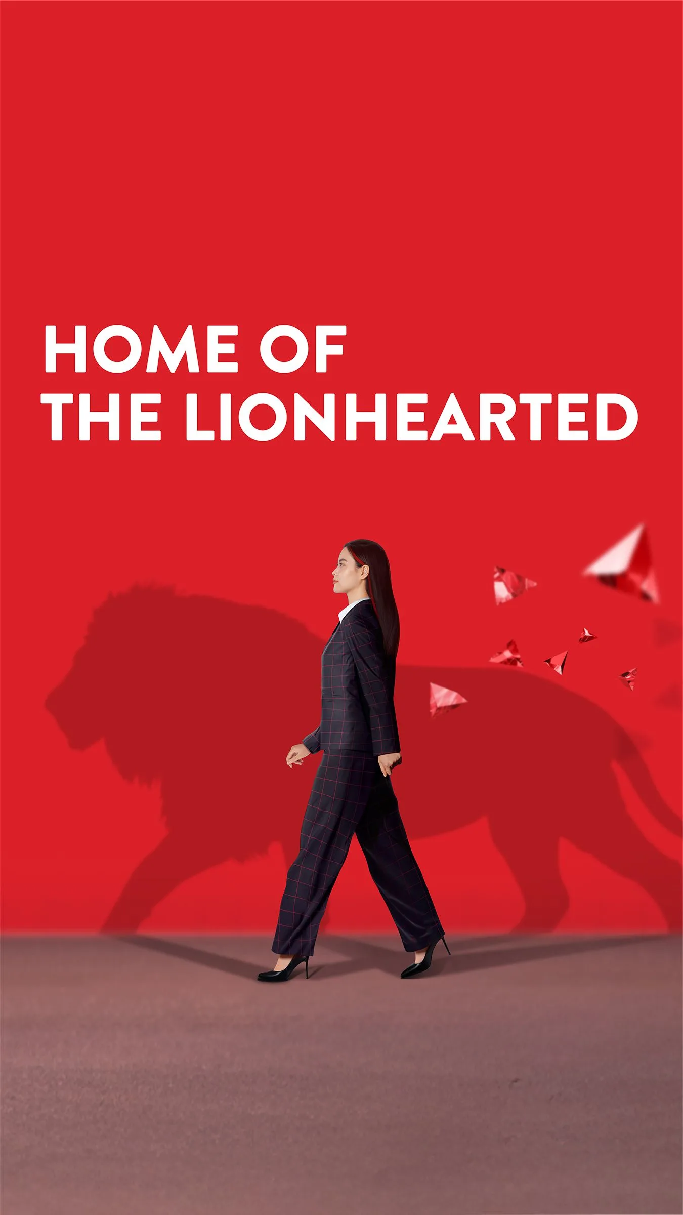 BUV “Home of the Lionhearted” mobile cover with a woman walking before a lion silhouette on a red background.