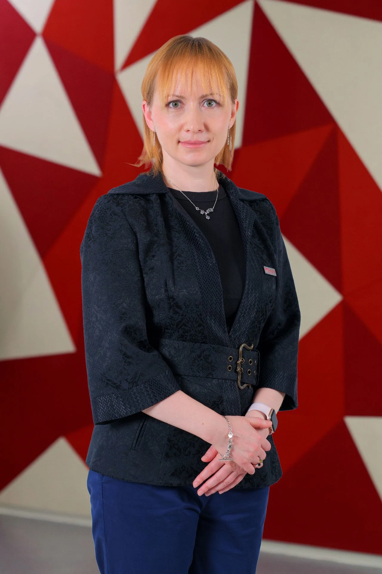 Dr. Valentina Gorchakova at British University Vietnam against a red geometric background