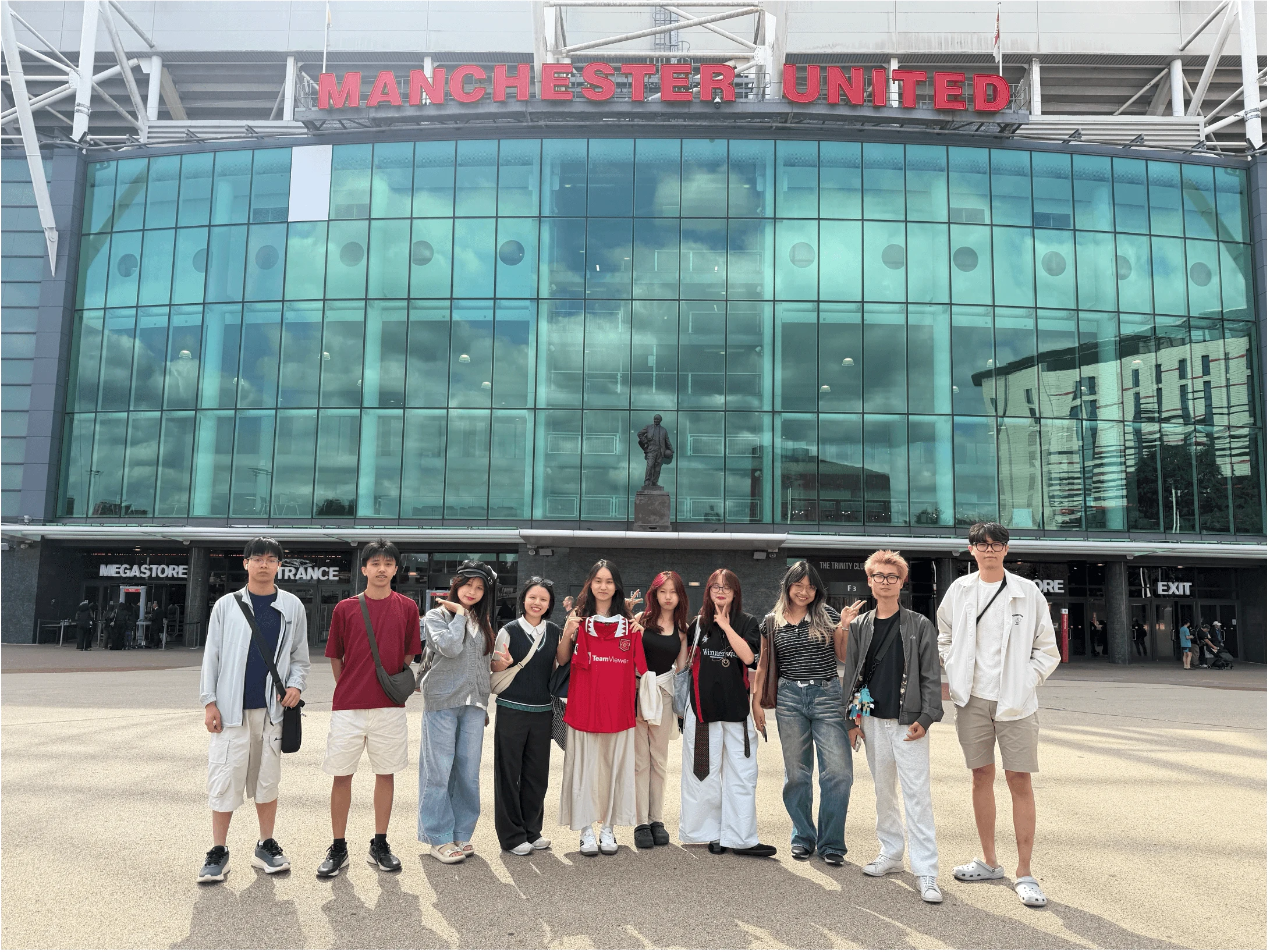 BUV students pose outside Old Trafford, Manchester United stadium, during an international experience programme.