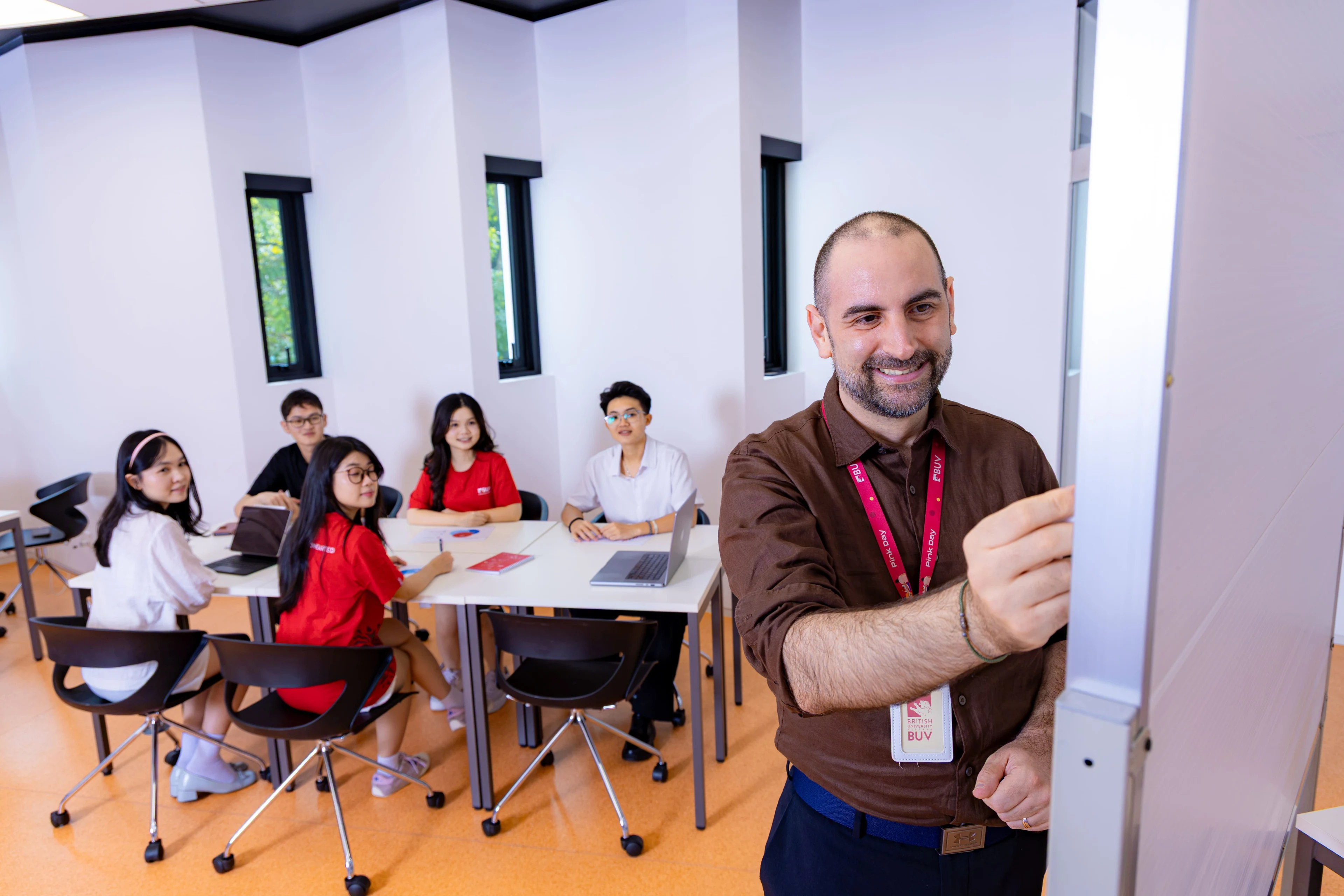 BUV lecturer teaching students in a modern classroom at British University Vietnam