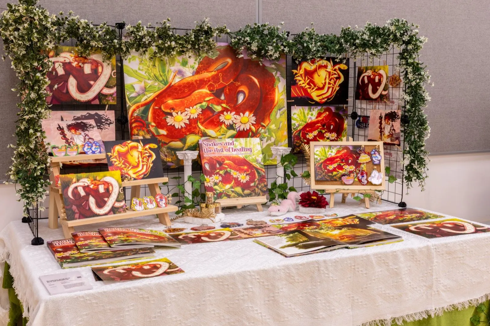 BUV student art display titled “Snakes and the Art of Healing,” featuring red snake prints and crafts