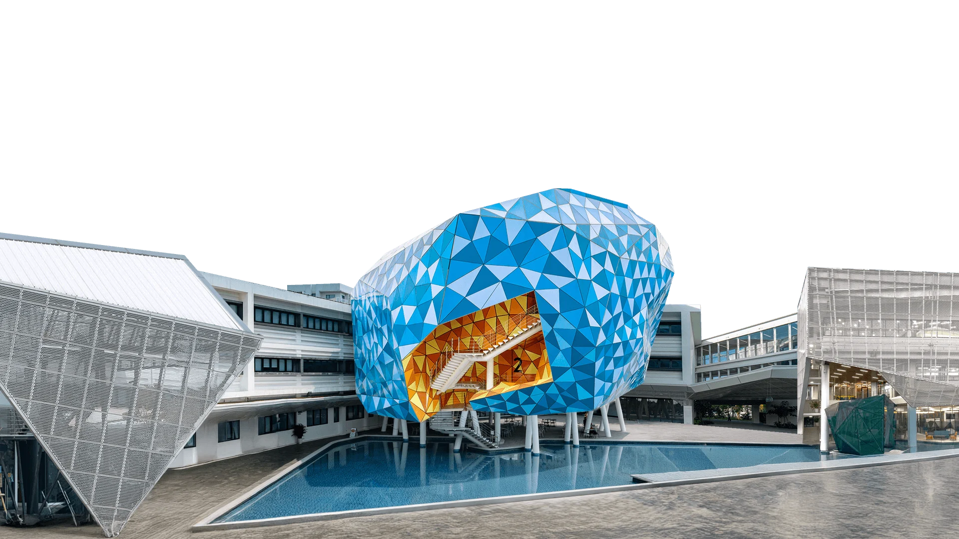 British University Vietnam (BUV) campus with a blue geometric building, pool and modern international university facilities