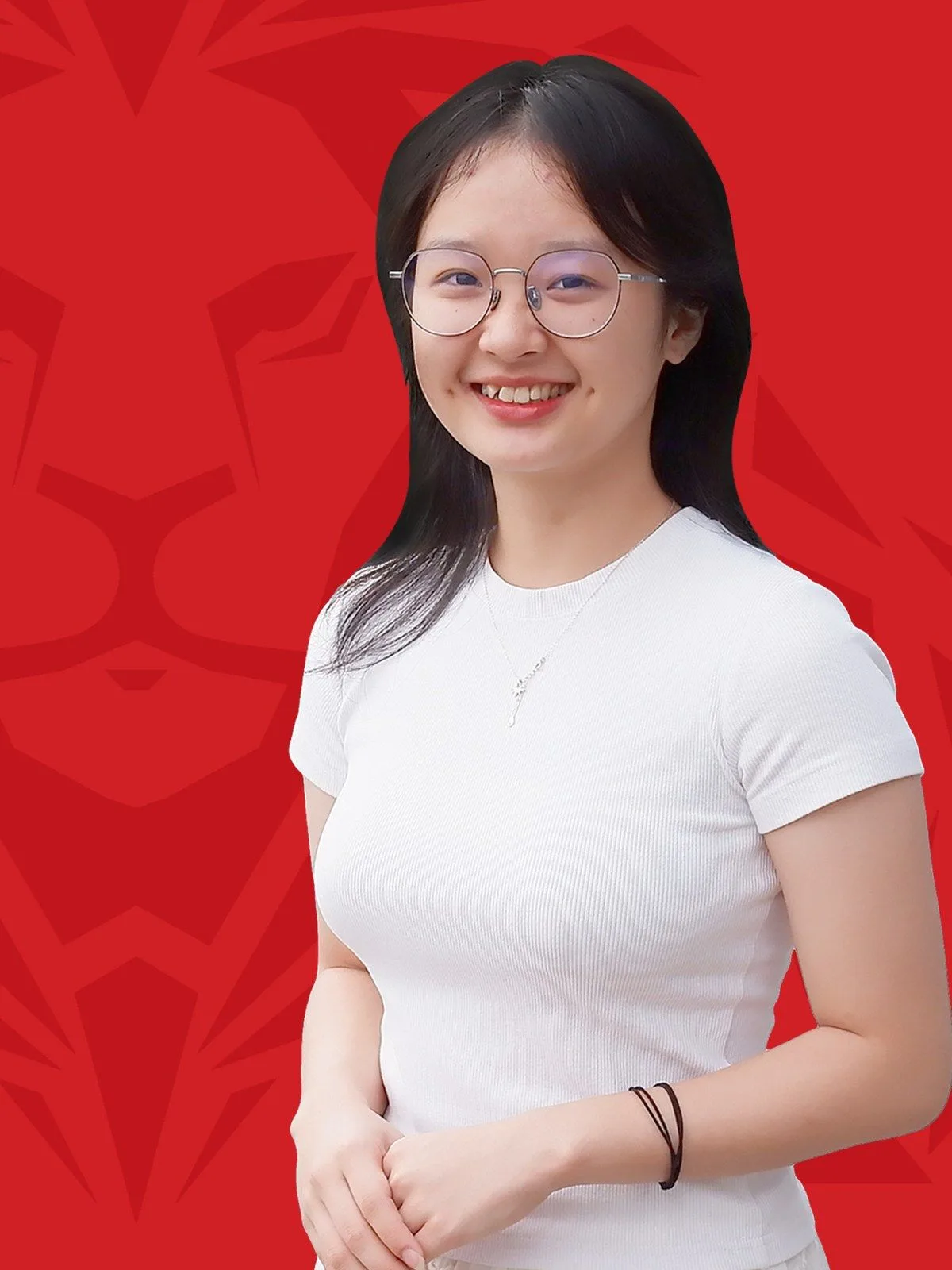 Ngoc Anh smiling in a white top against a red lionhearted portrait background.