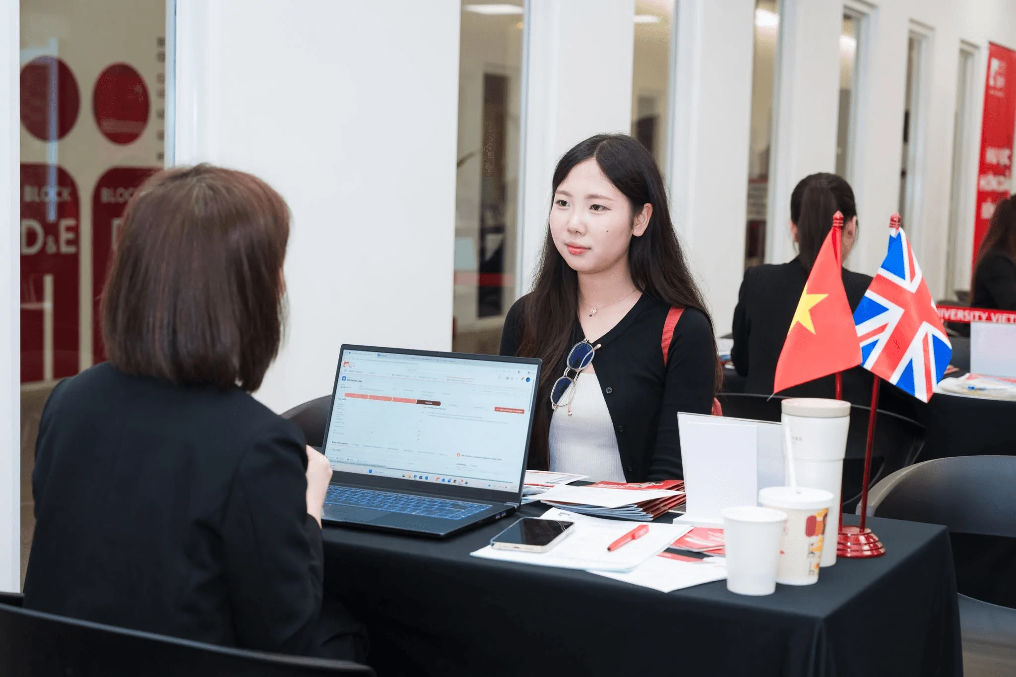 Student recruitment conversation at a BUV desk