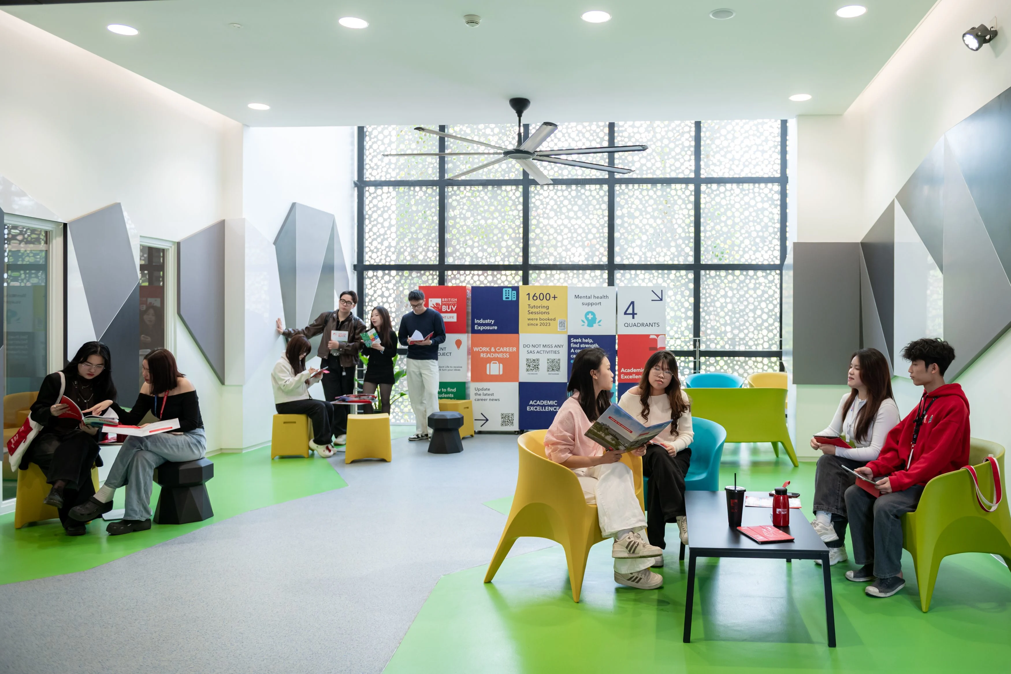 BUV students studying and socialising in a vibrant British University Vietnam campus lounge