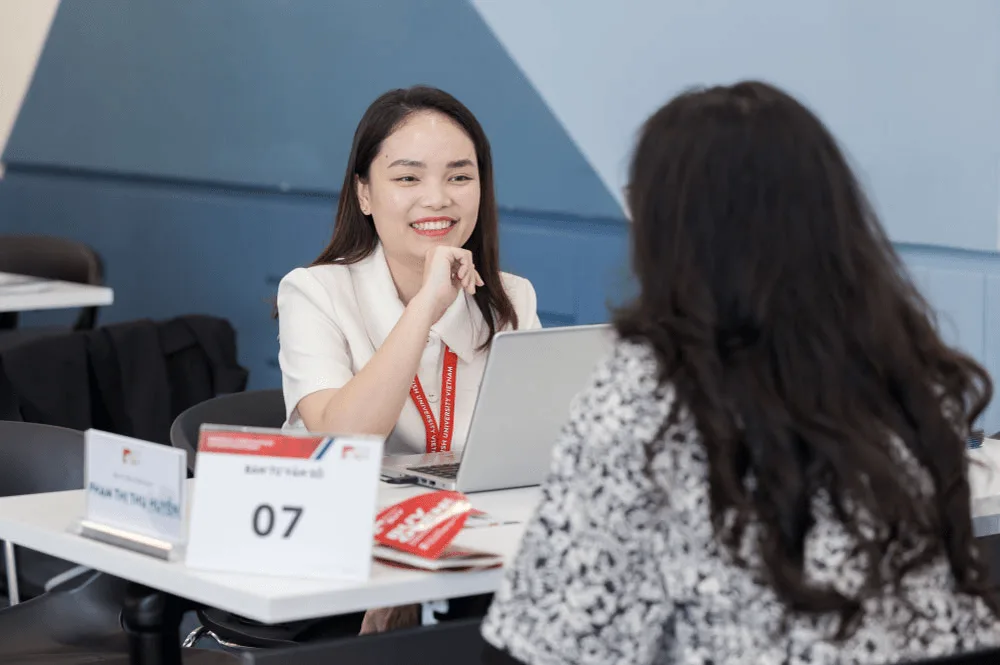 BUV admissions advisor speaking with a prospective student at a university consultation desk