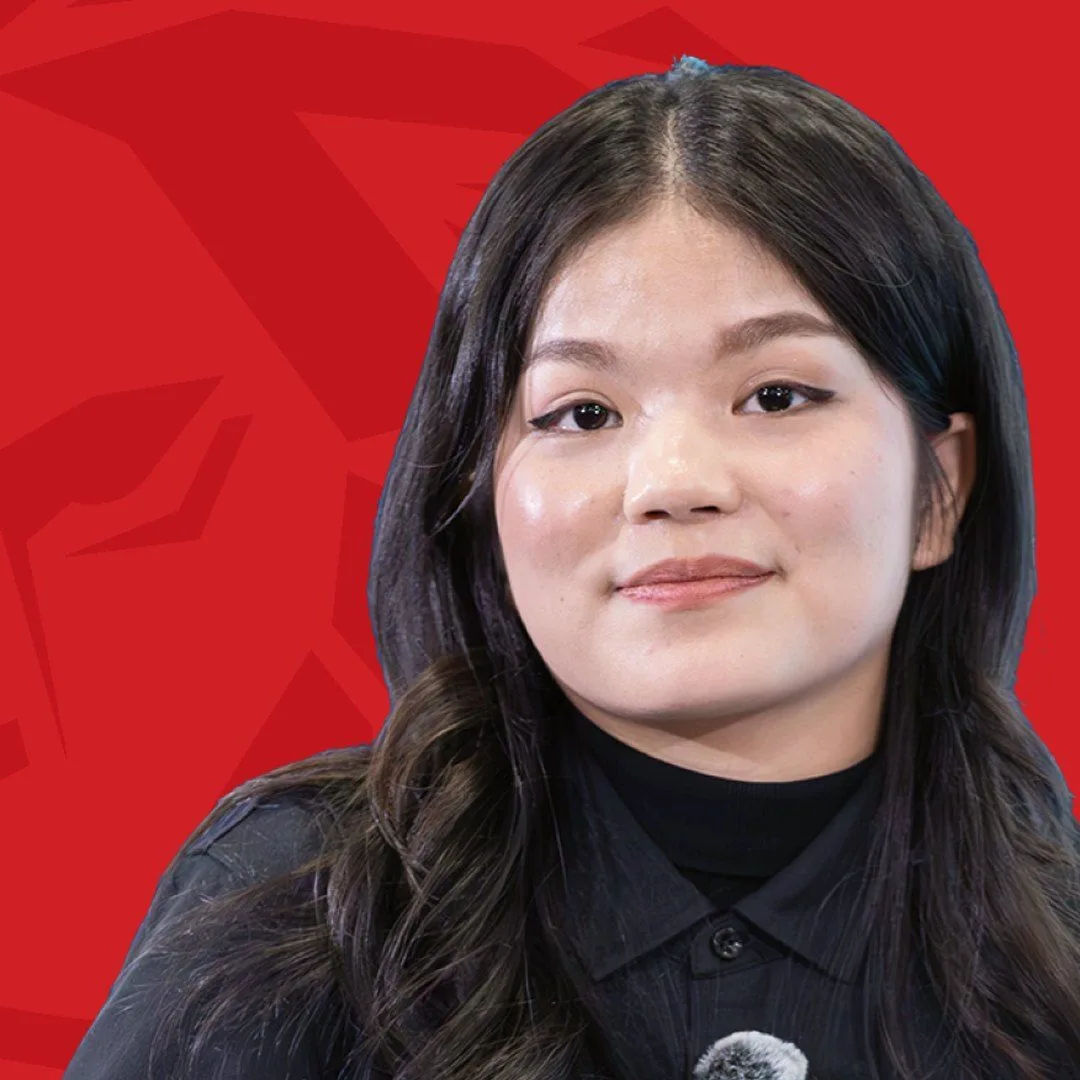 BUV alumna Minh Yen in a black shirt against a red background, featured in the “Lionhearted” alumni series.