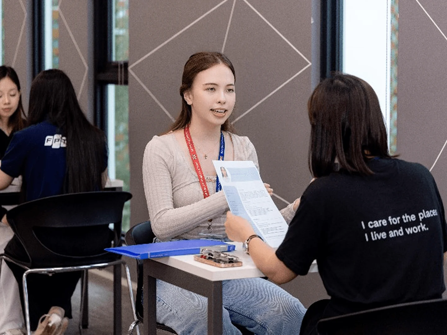 BUV student consultation with an advisor discussing university information at a British University Vietnam campus event