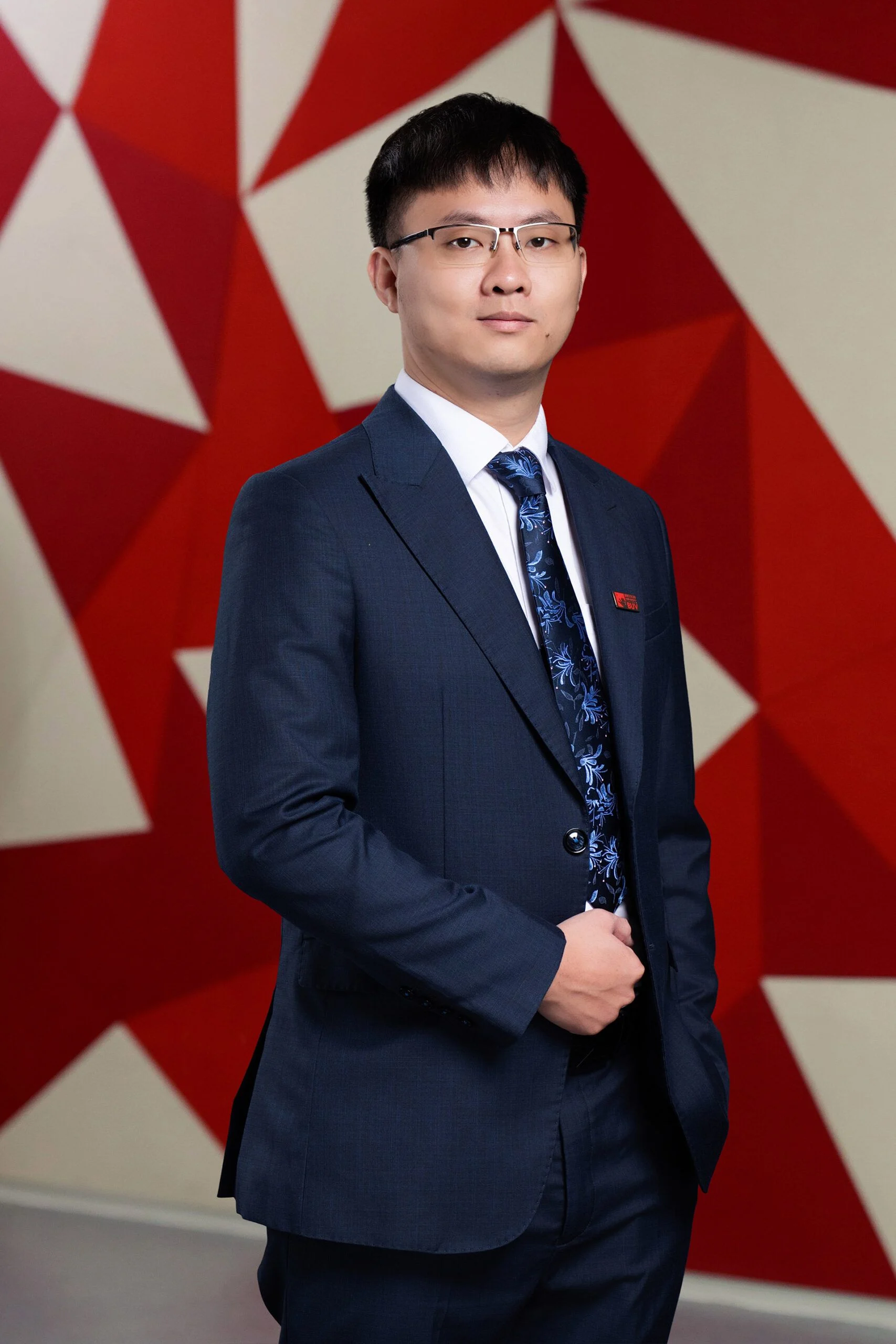 Bui Hoang Ha Chau in a navy suit at British University Vietnam (BUV)
