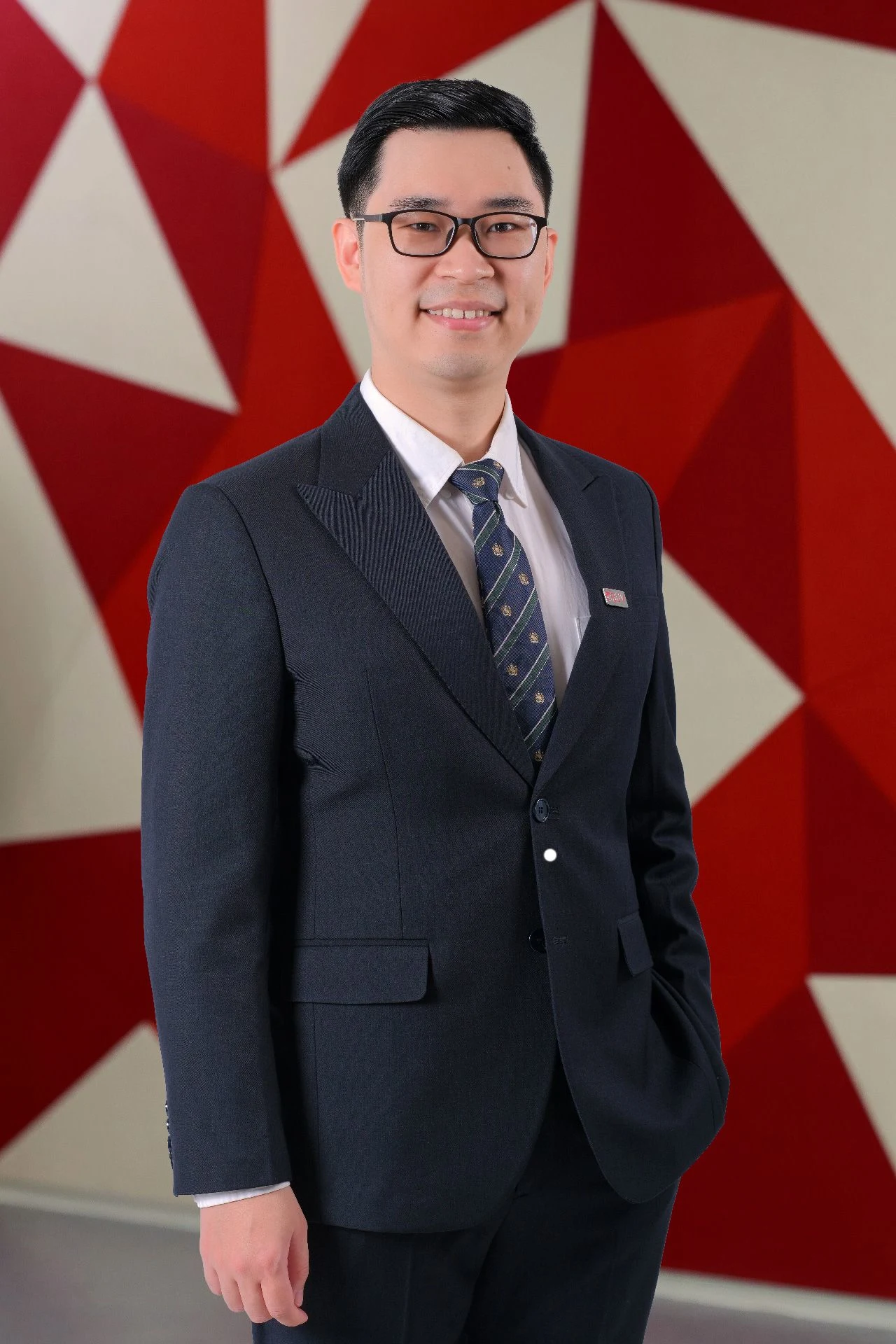 Dr Hoang Ta in a navy suit at British University Vietnam (BUV)
