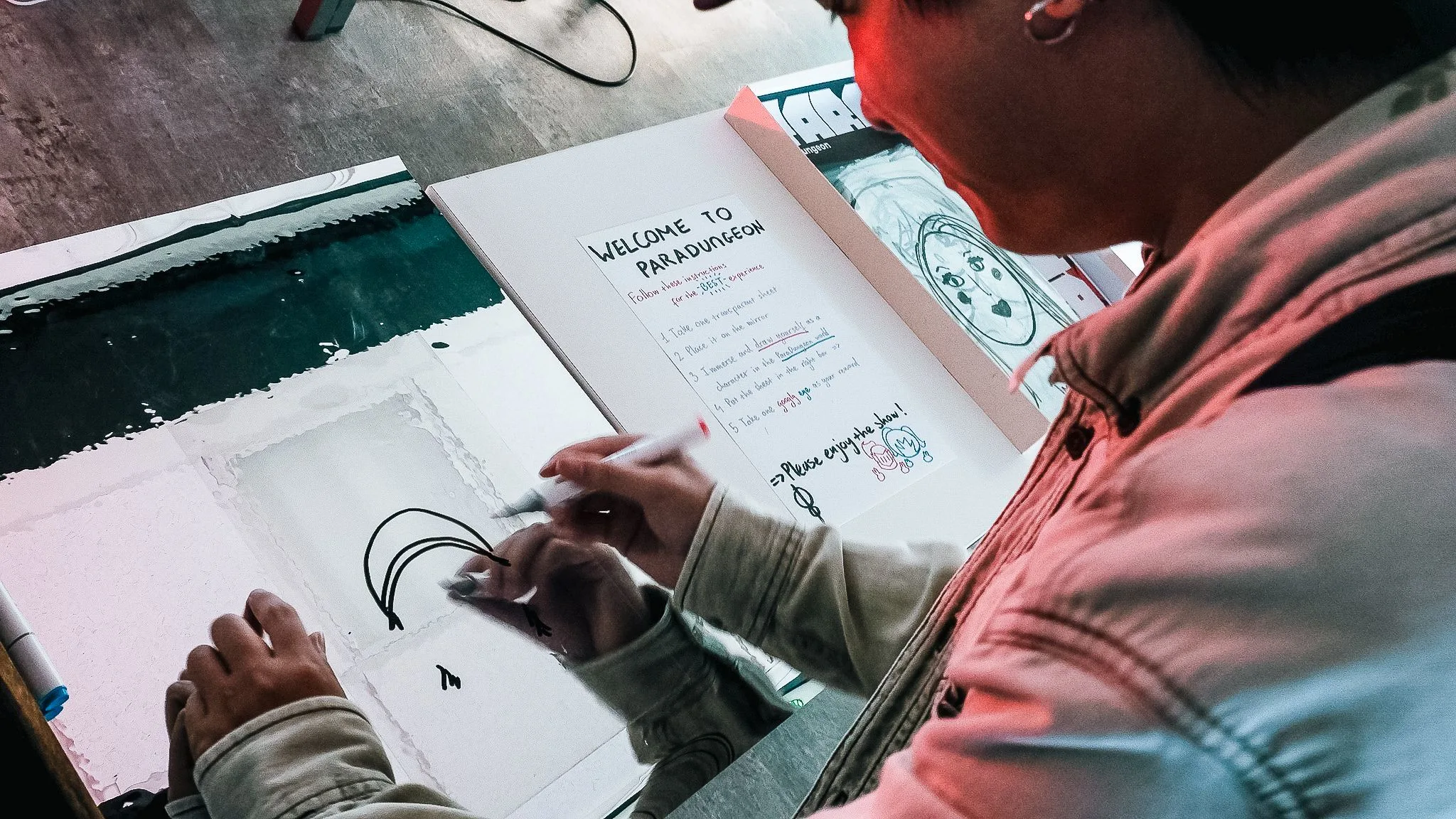 Art student drawing at the “Welcome to Paradungeon” creative workshop