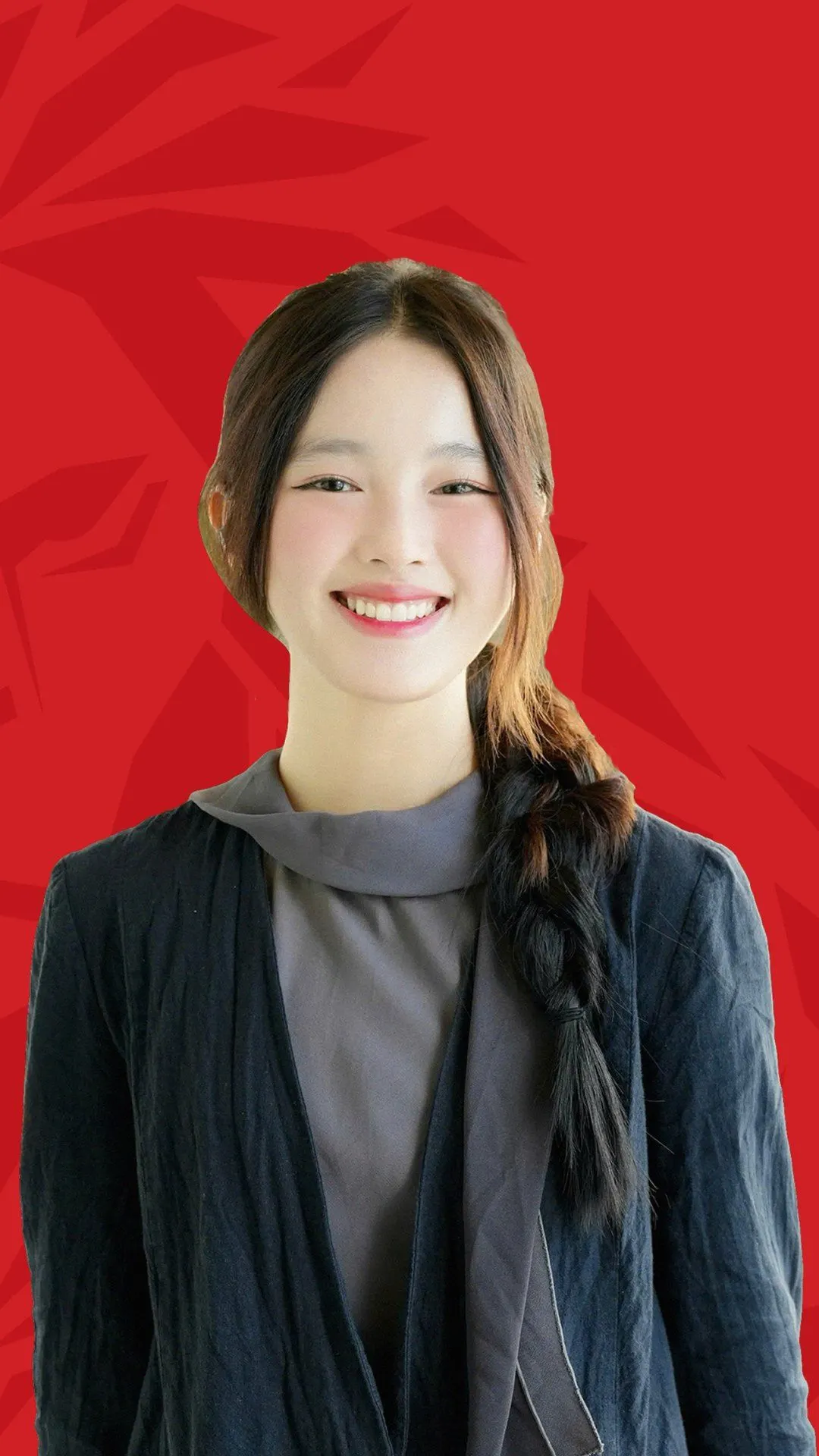BUV alumna Phuong Anh smiling in a portrait against a red Lionhearted campaign background.