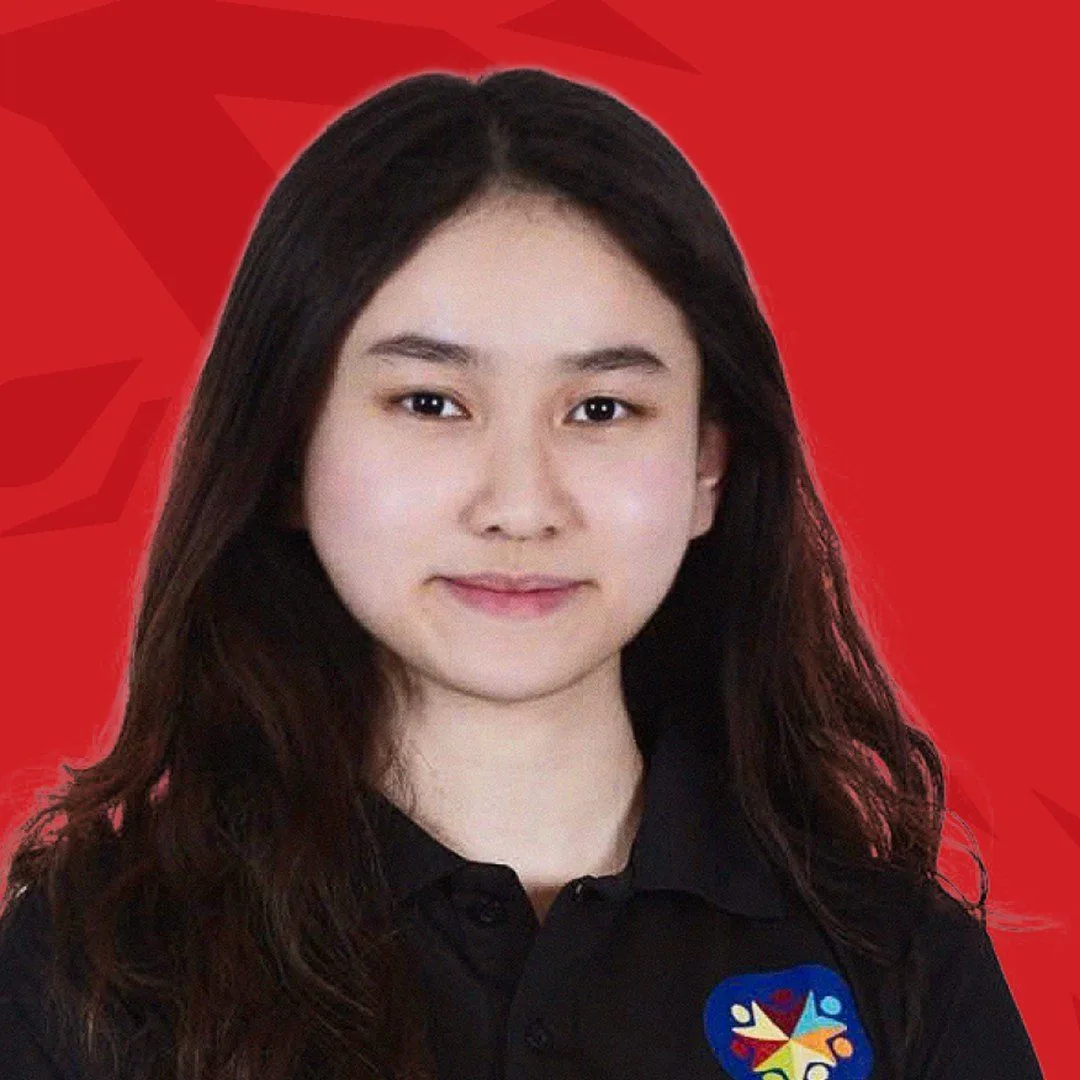 BUV alumna Linh Giang wearing a black shirt with a colorful badge against a red background.